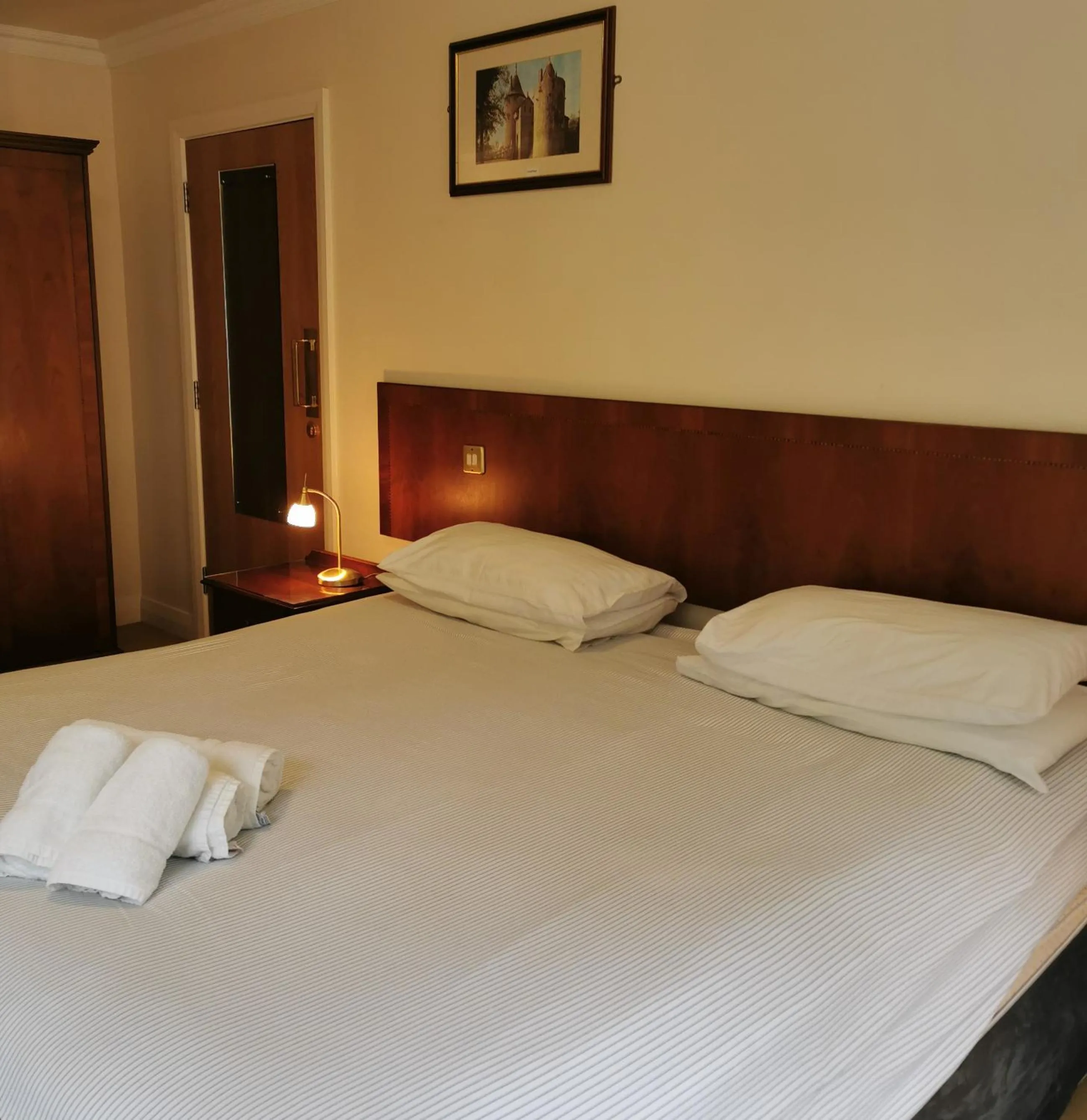 Bed in Three Rivers Hotel