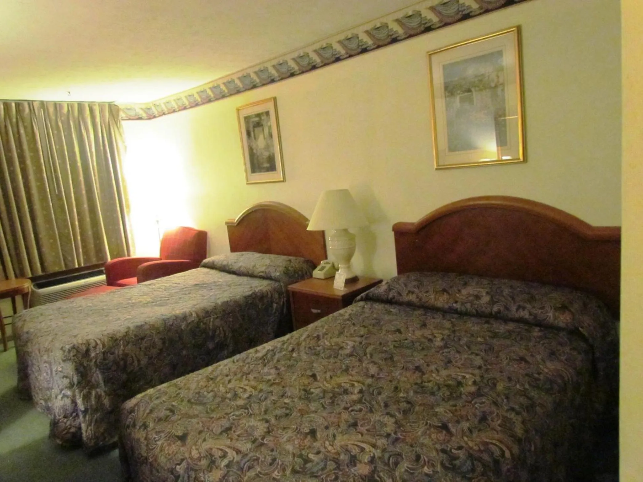 Bed in Travel Inn & Suites