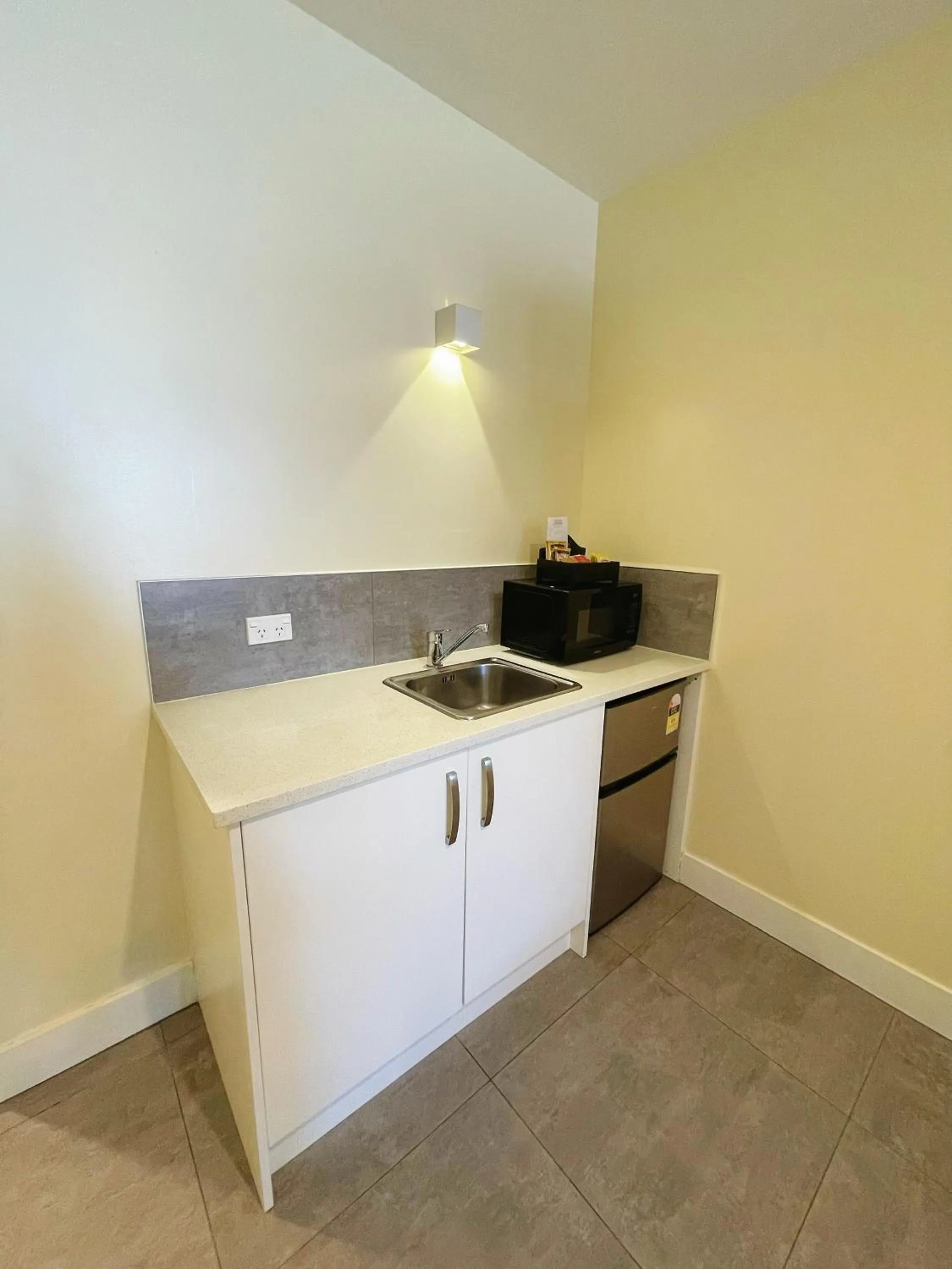 Kitchen or kitchenette in Grand Central Serviced Apartments