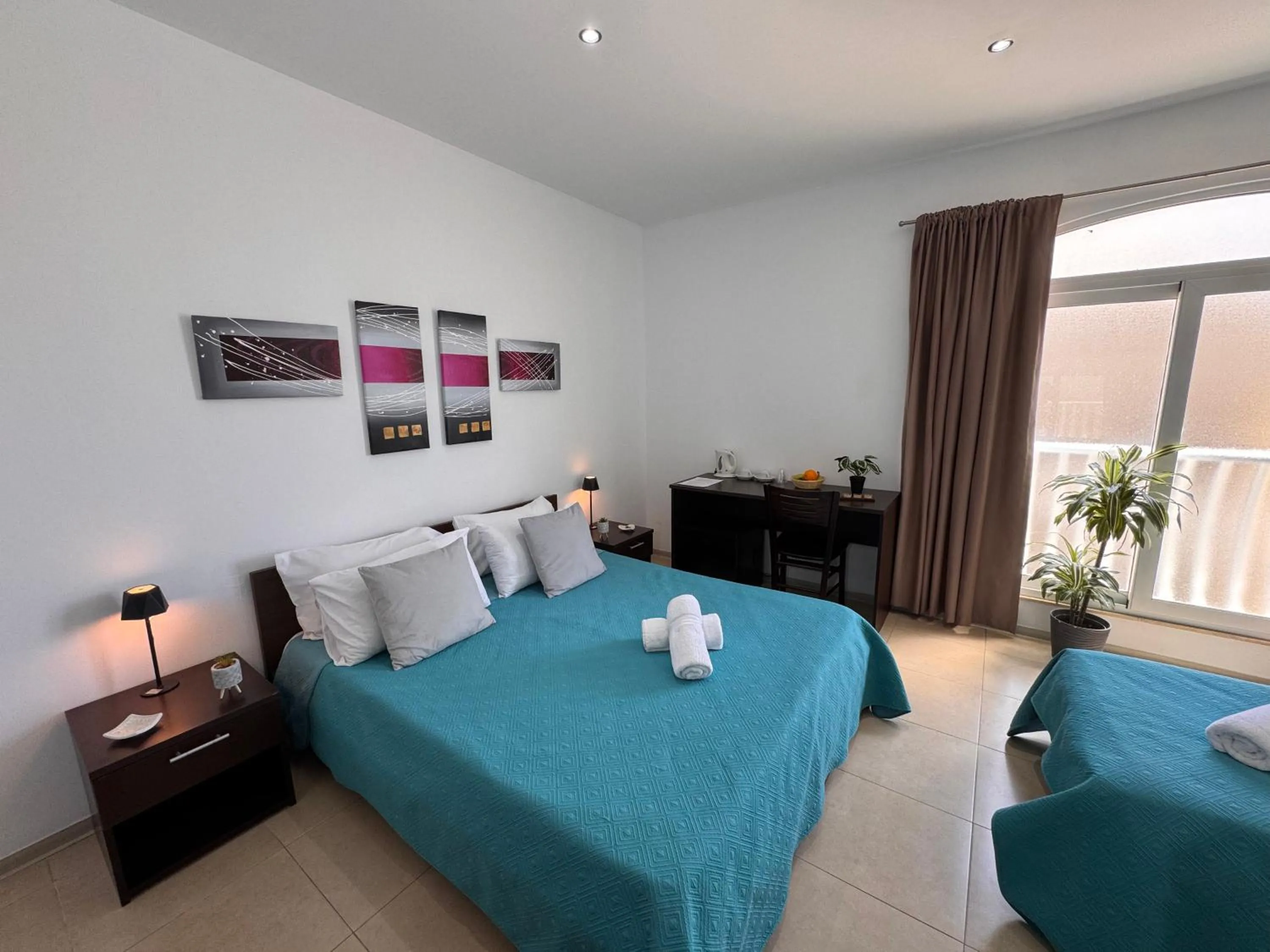 Bed in Allegro Hotel