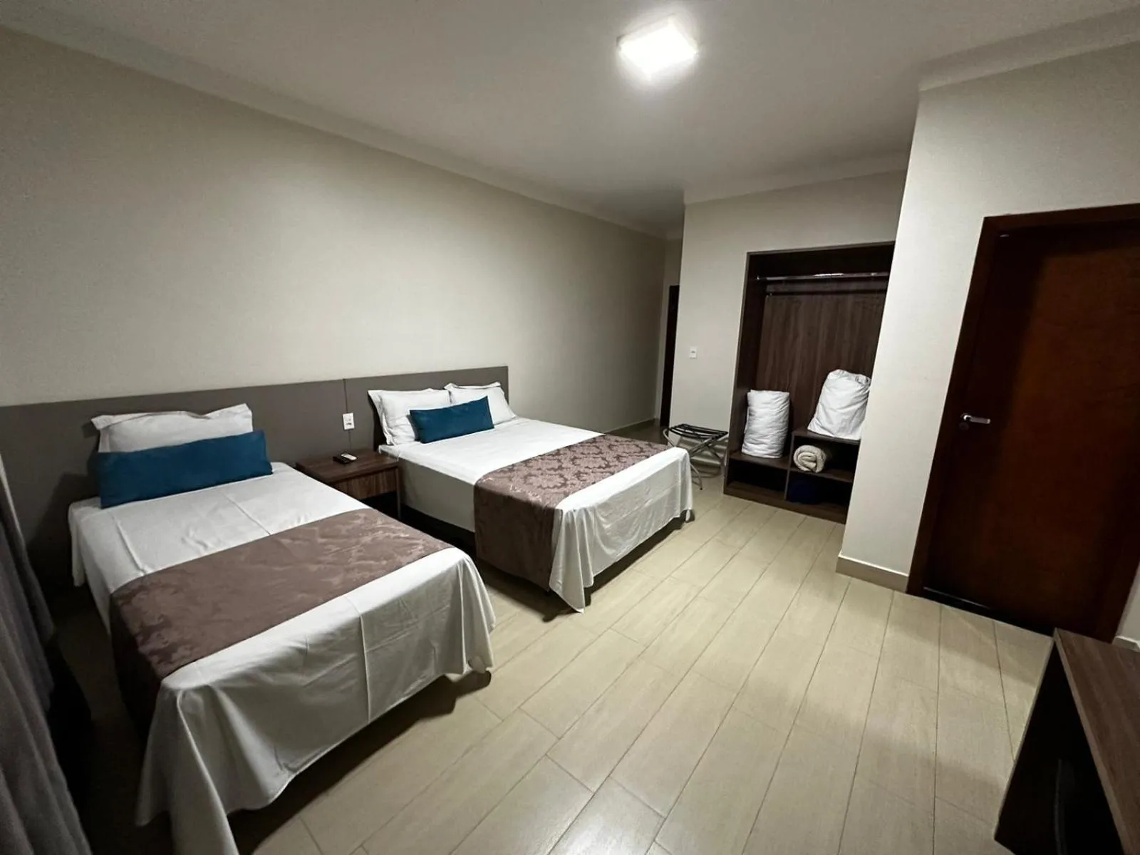 Bed in Racini Suites Hotel