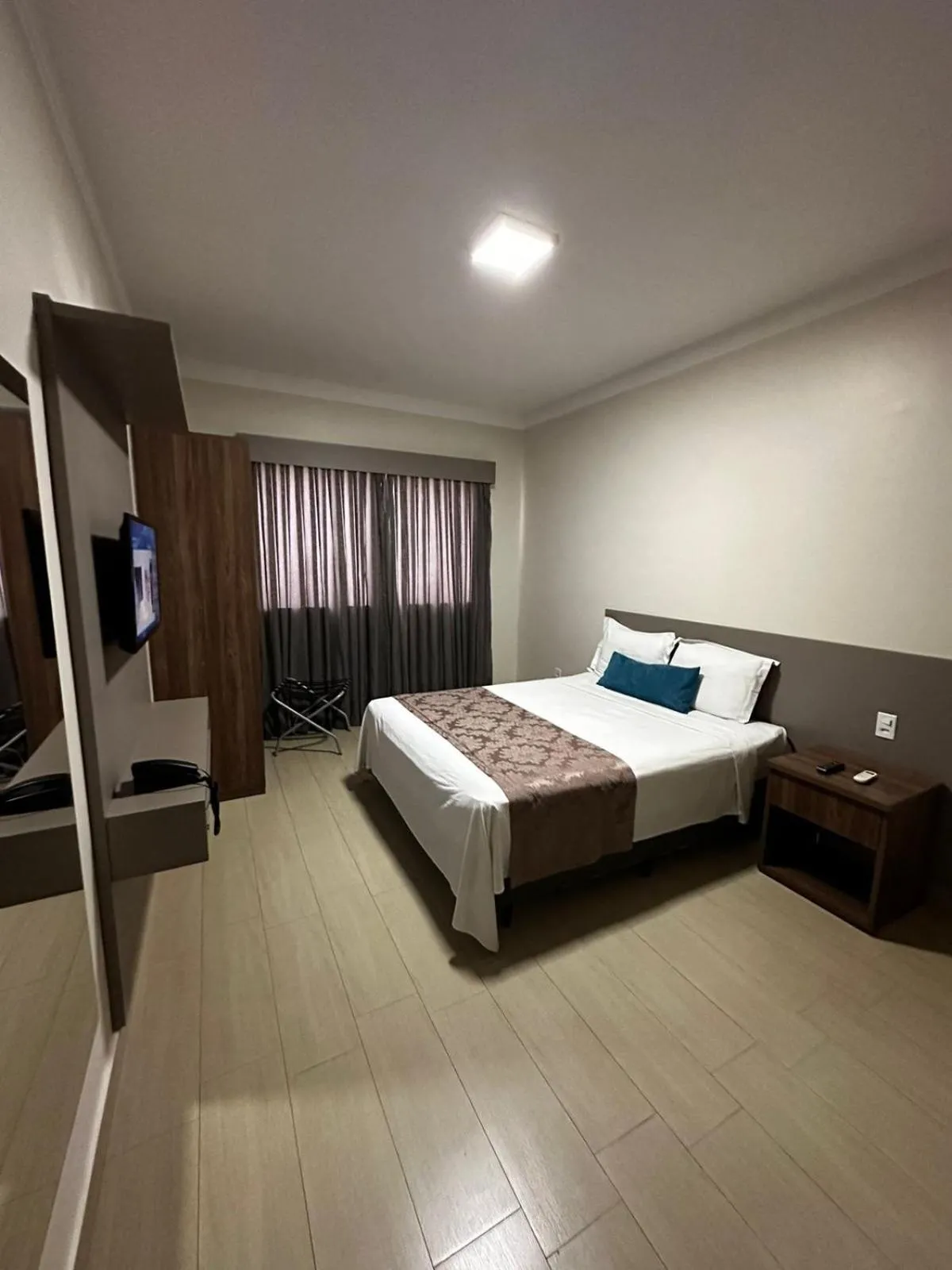 Bed in Racini Suites Hotel