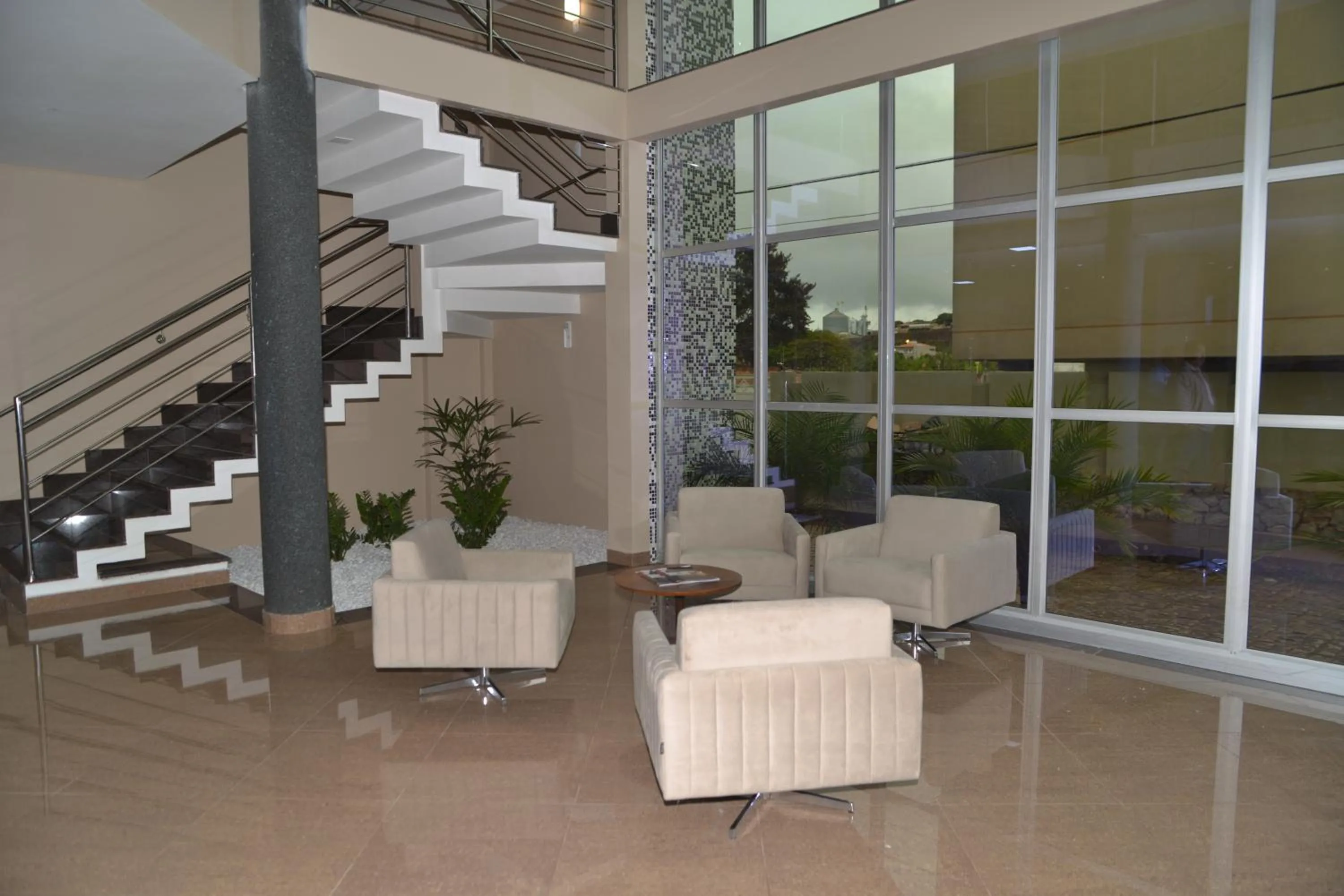 Lobby or reception in Racini Suites Hotel
