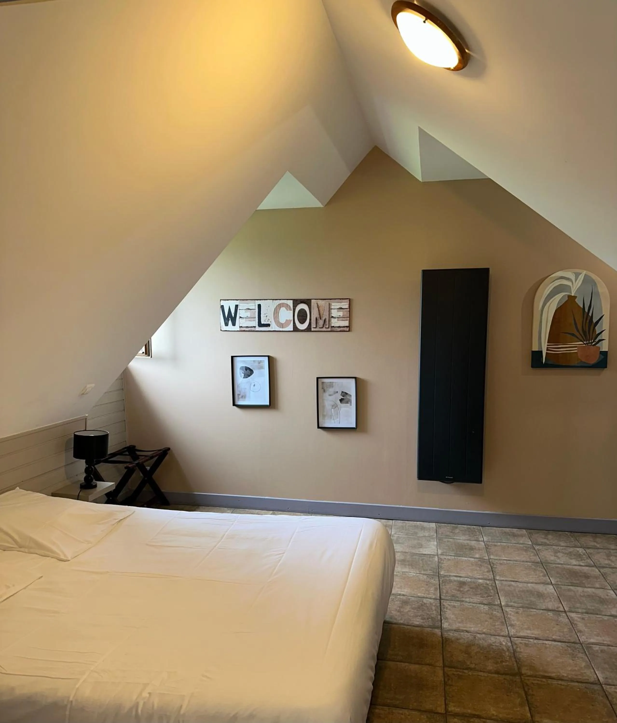 Bed in Logis Hôtel Volcan Sancy