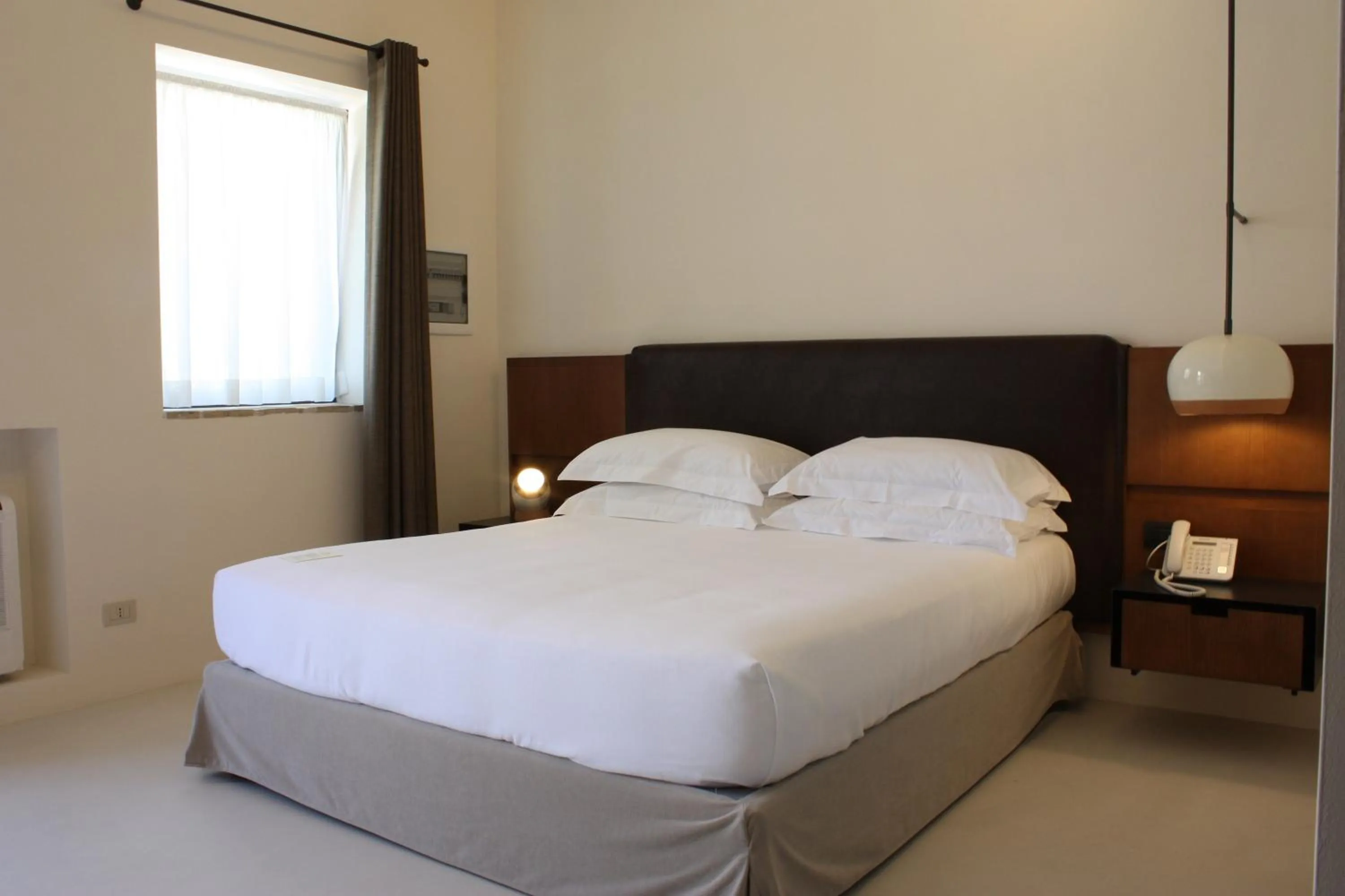 Photo of the whole room, Bed in Masseria Amastuola Wine Resort