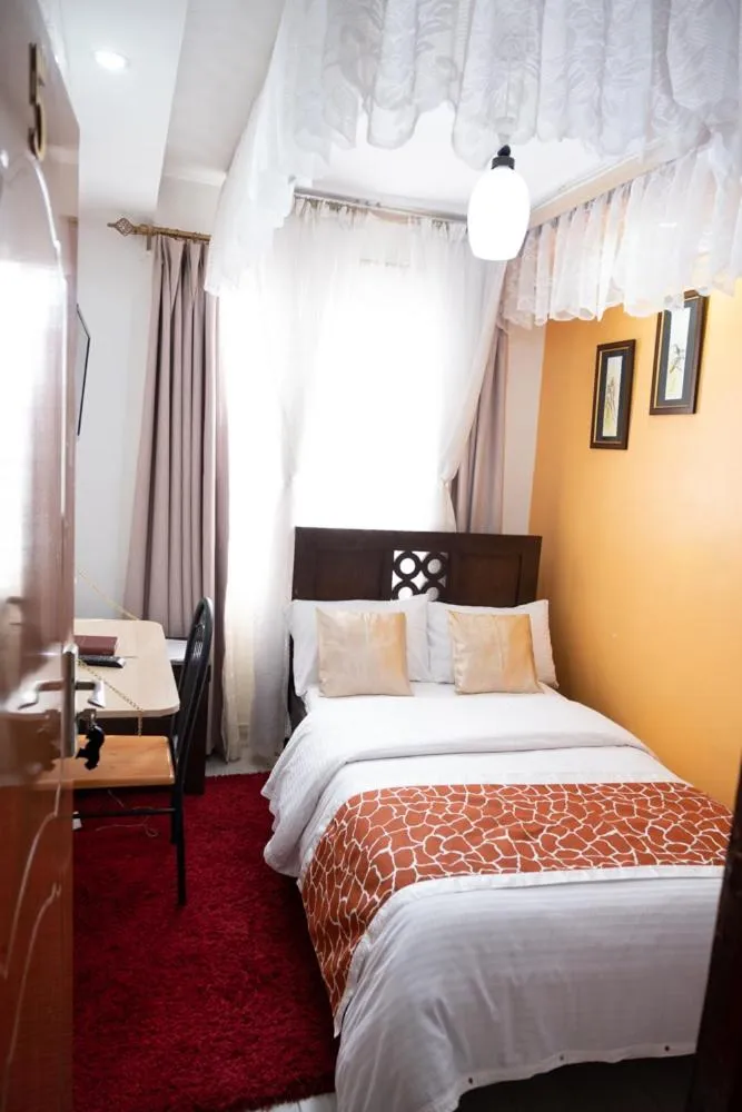 Bed in Javilla Eagles Safari Guest house