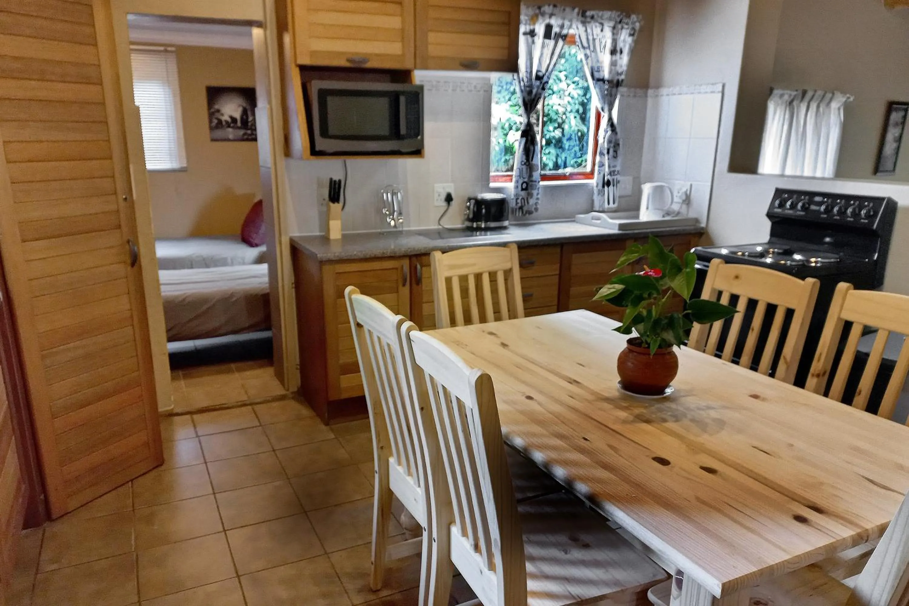Kitchen or kitchenette, Bed in Mount Sheba Rainforest Hotel - Mountain Spring Water