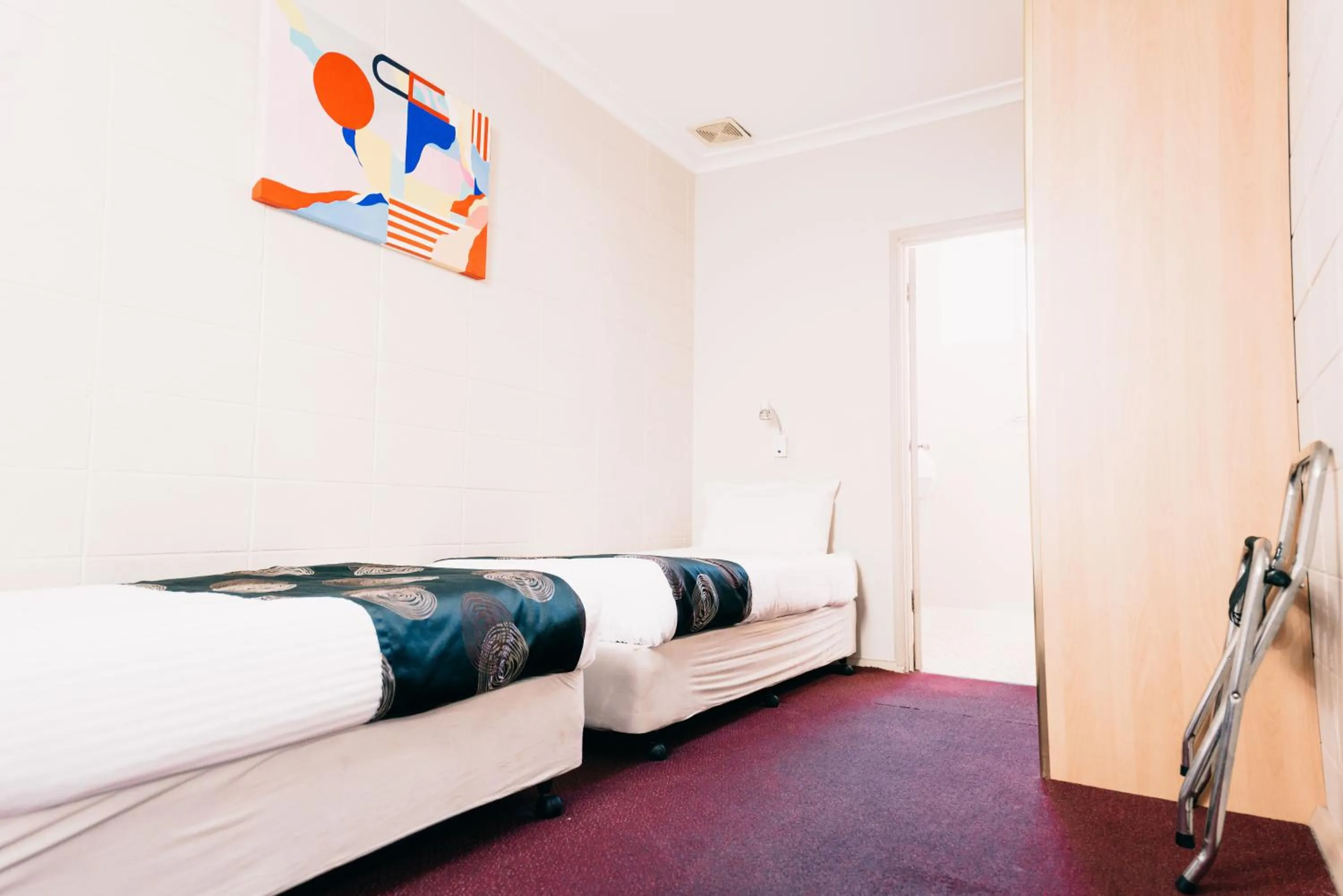 Bed in Motel Poinsettia