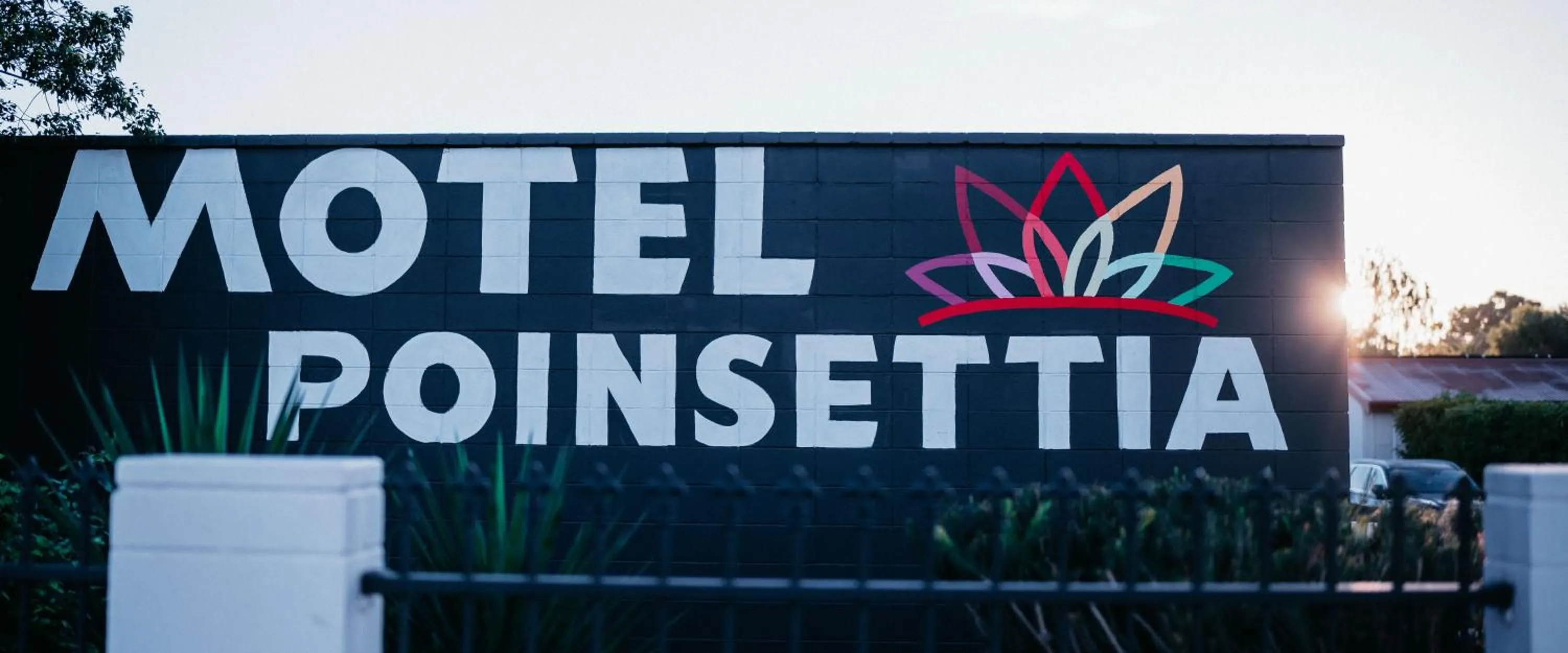 Property logo or sign in Motel Poinsettia