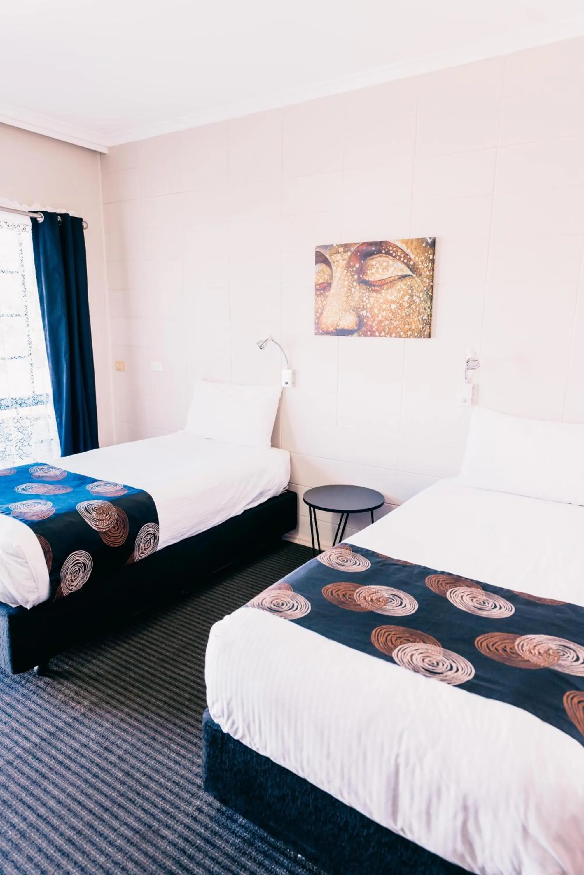 Bed in Motel Poinsettia