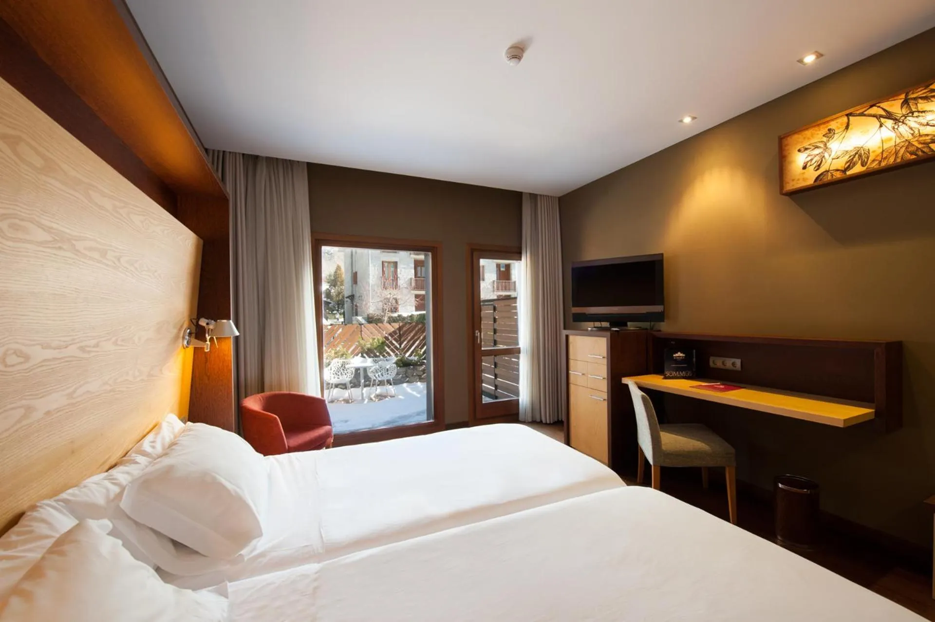 Bed in SOMMOS Hotel Aneto