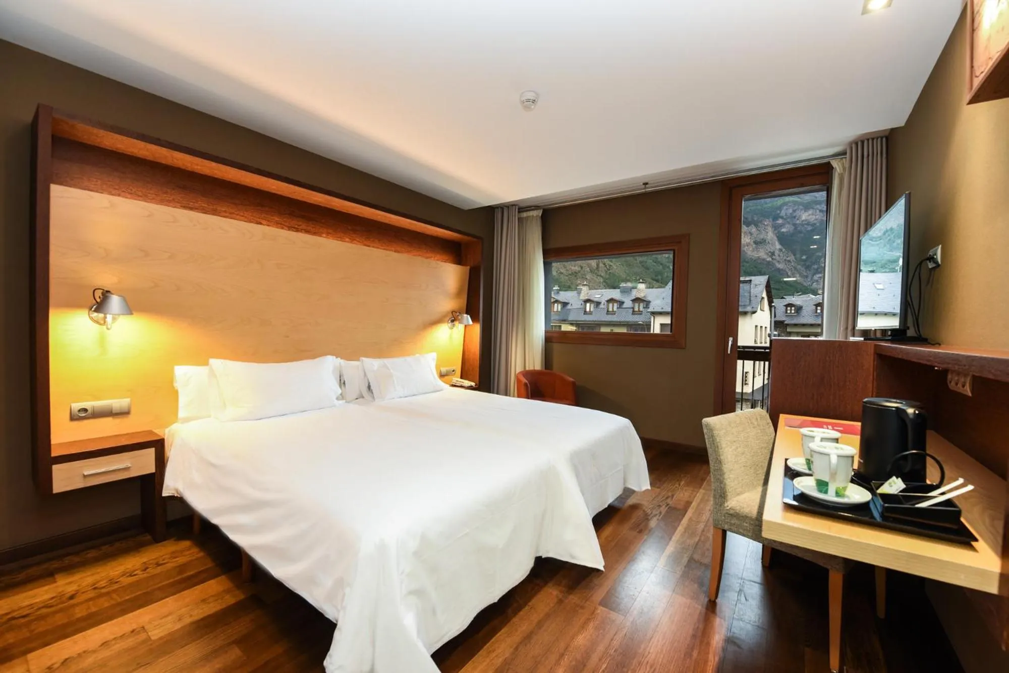 Bed in SOMMOS Hotel Aneto