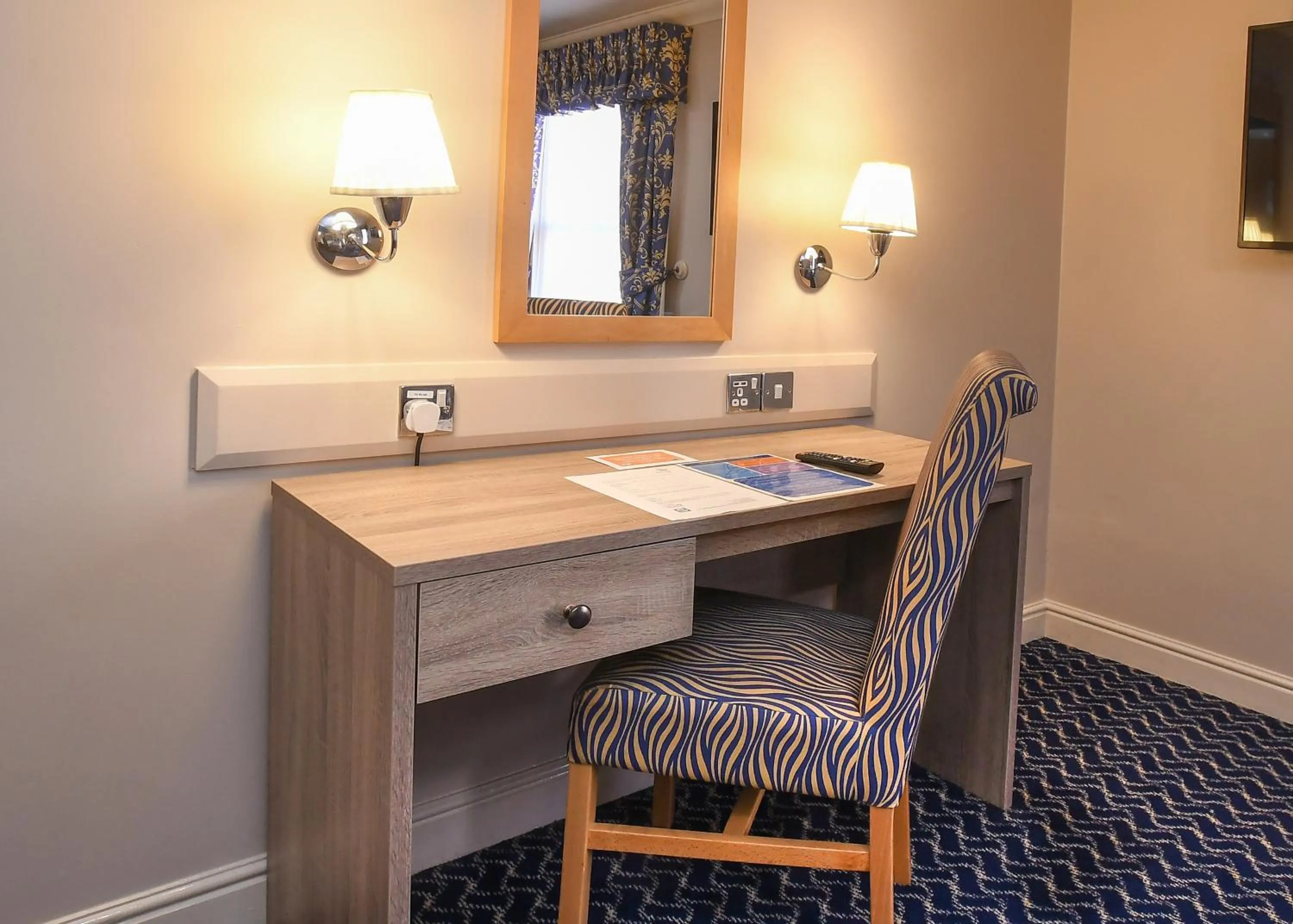Bedroom in The Queens Hotel & Victoria Cloisters Apartments
