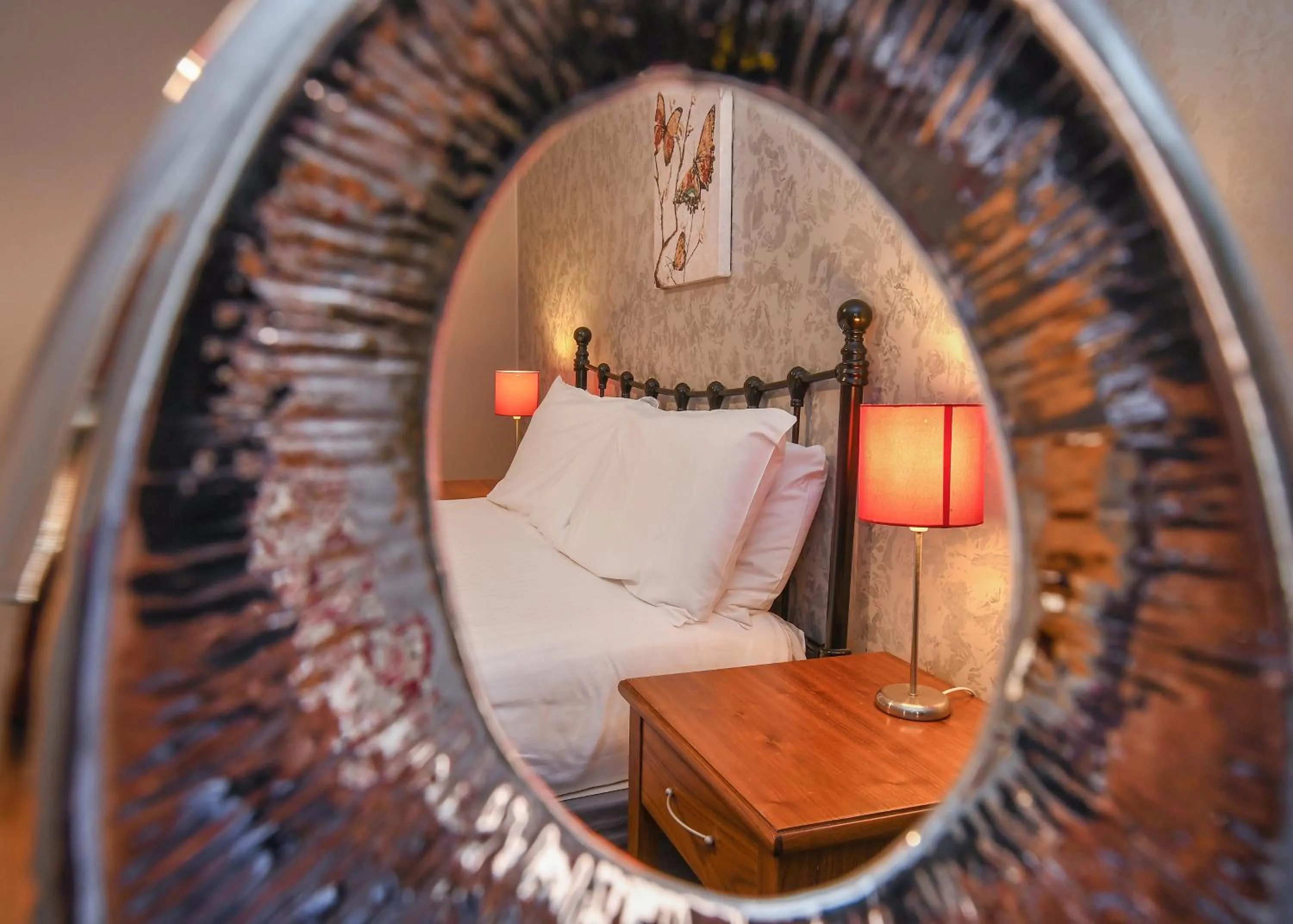 Decorative detail, Bed in The Queens Hotel & Victoria Cloisters Apartments