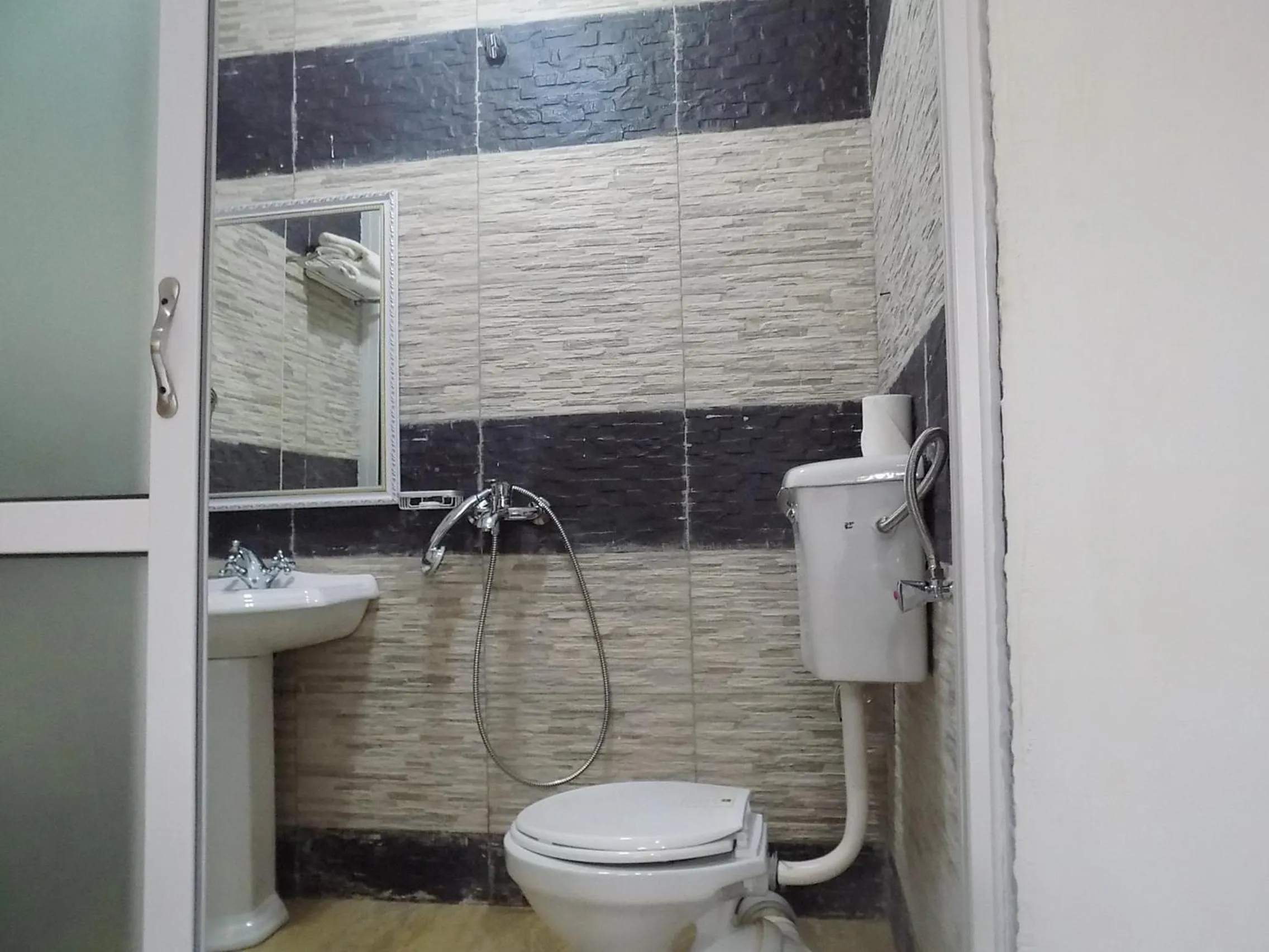 Bathroom in Remmings Hotel Kampala