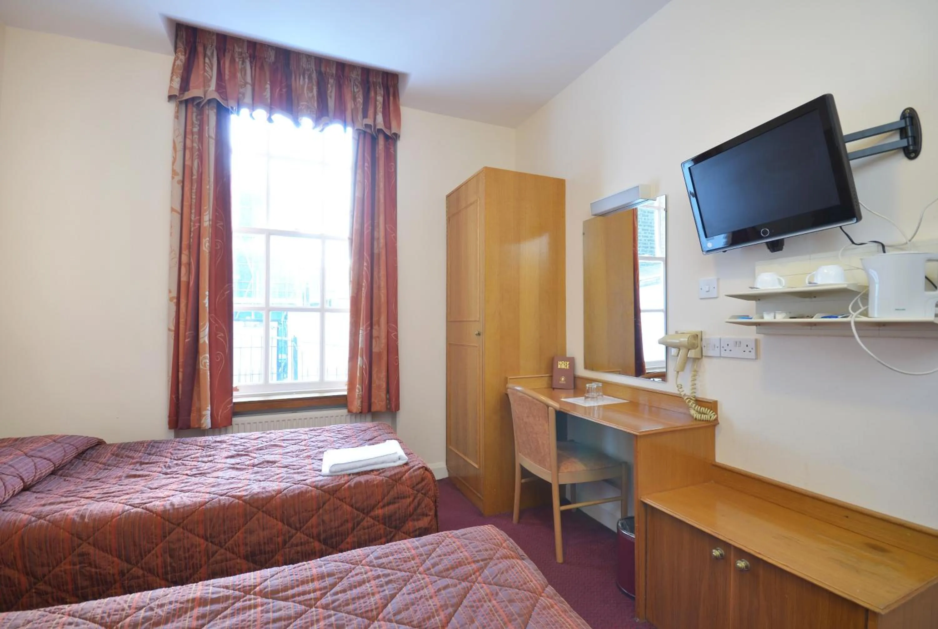 Bed in Seymour Hotel