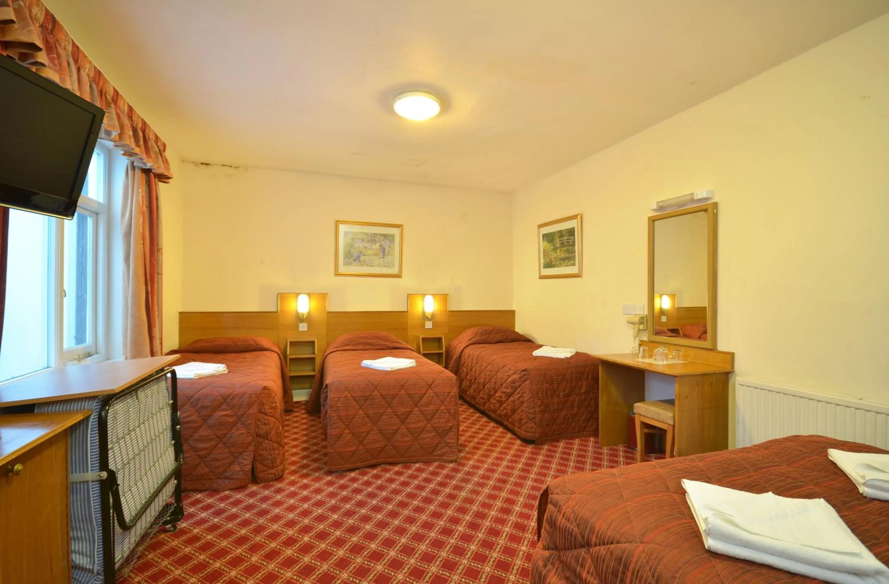 Bed in Seymour Hotel