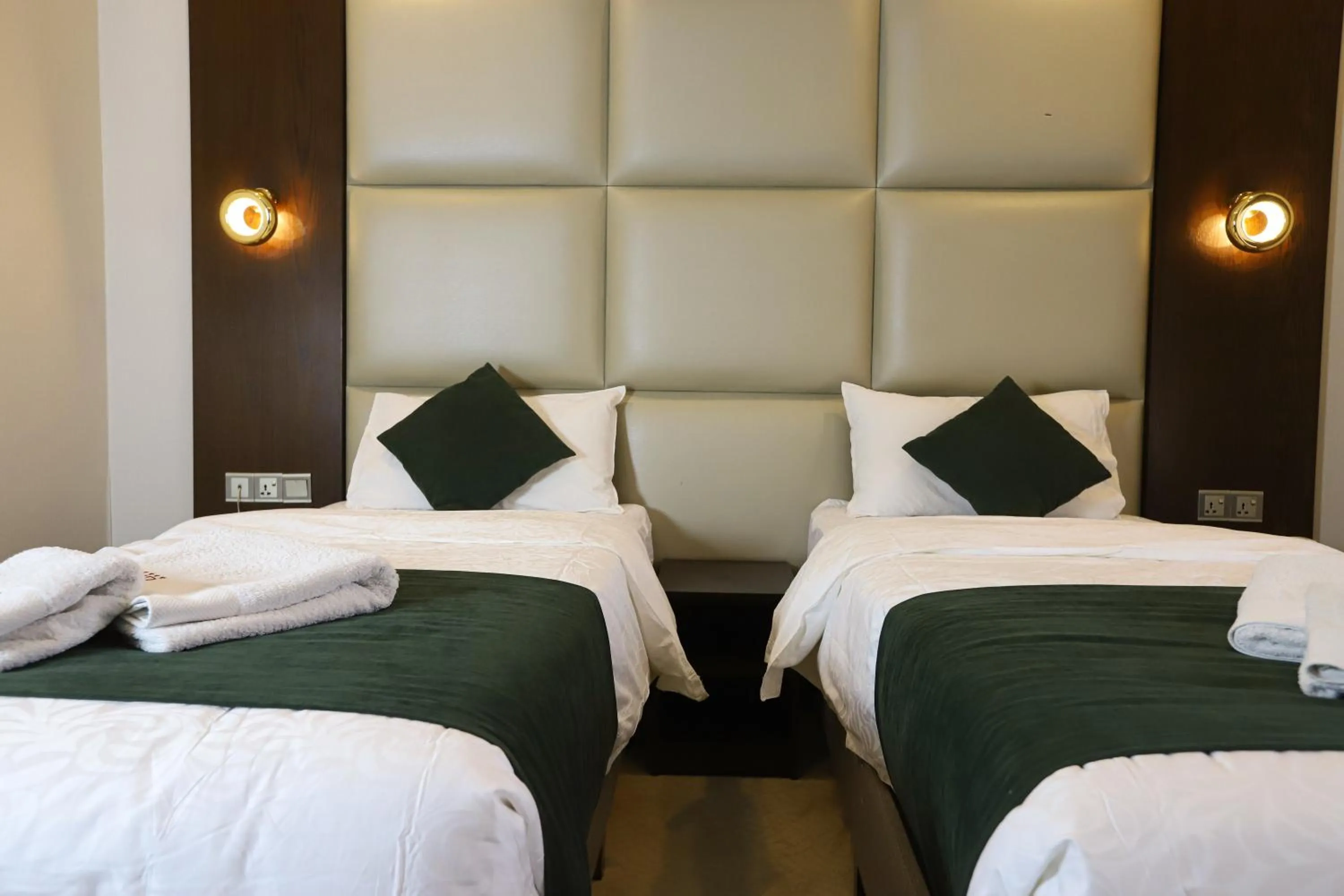 Bed in Paris Plaza Hotel