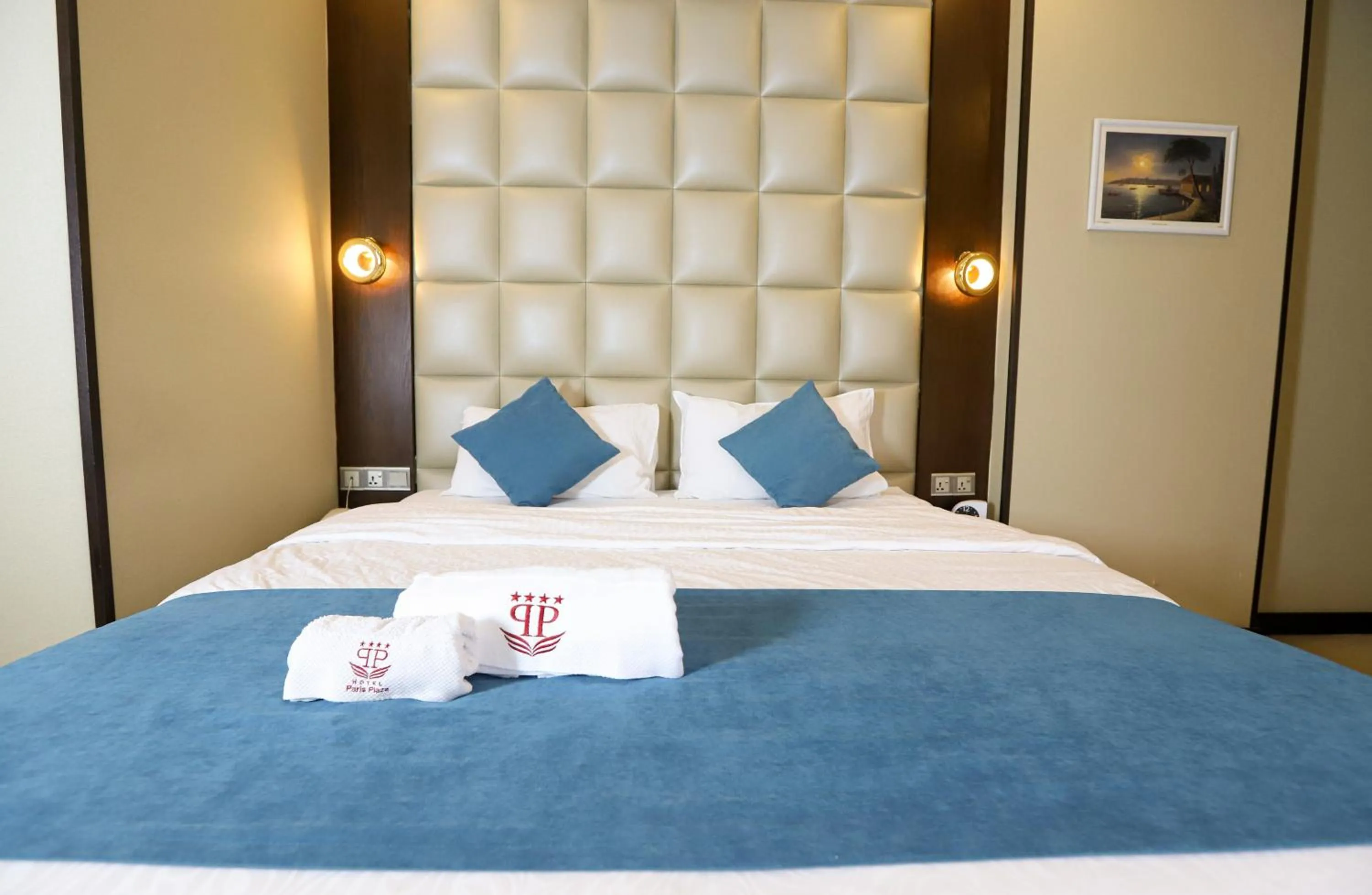 Bed in Paris Plaza Hotel