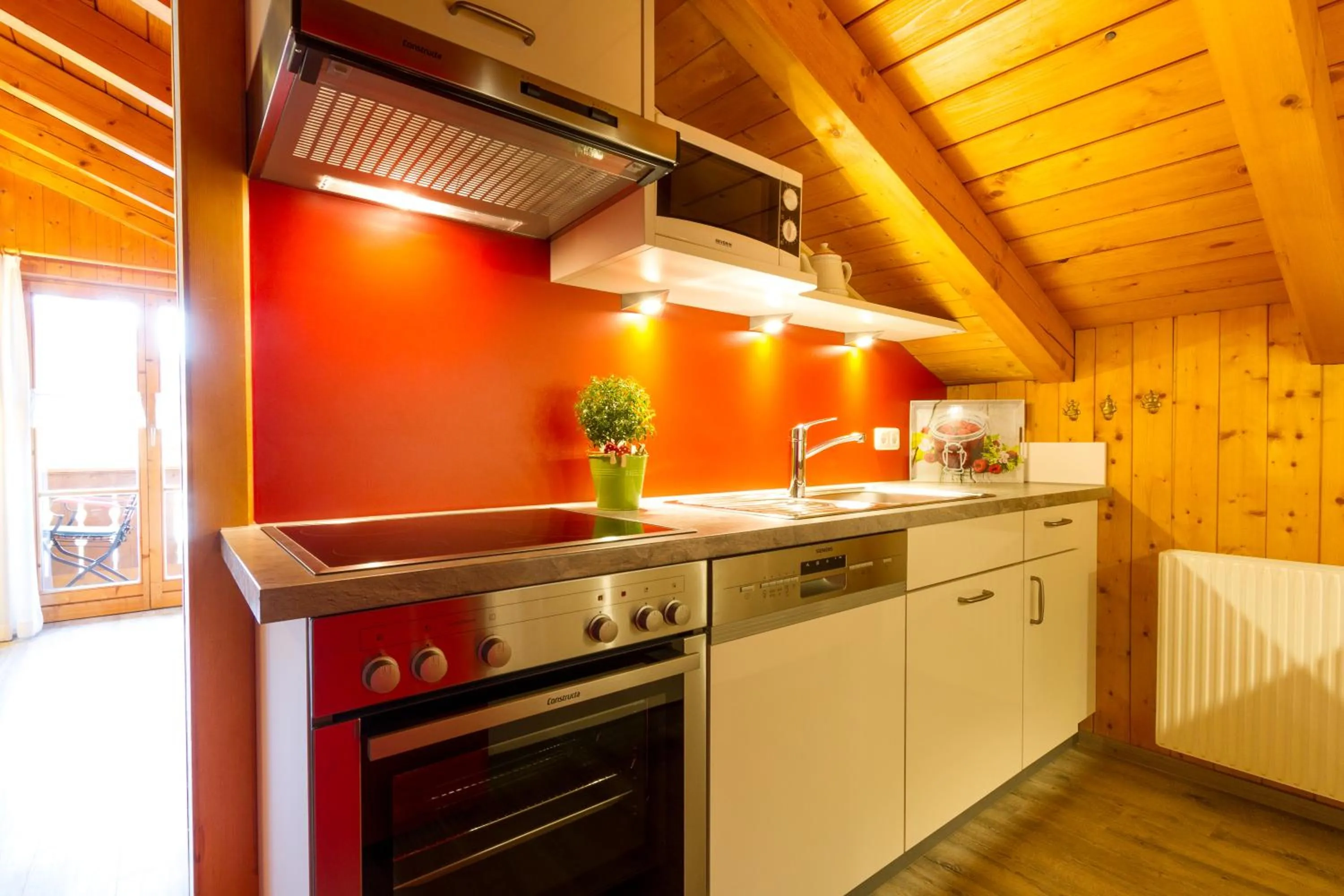 Kitchen or kitchenette in Ferienwohnungen Alpentraum - Landhaus am Bächle