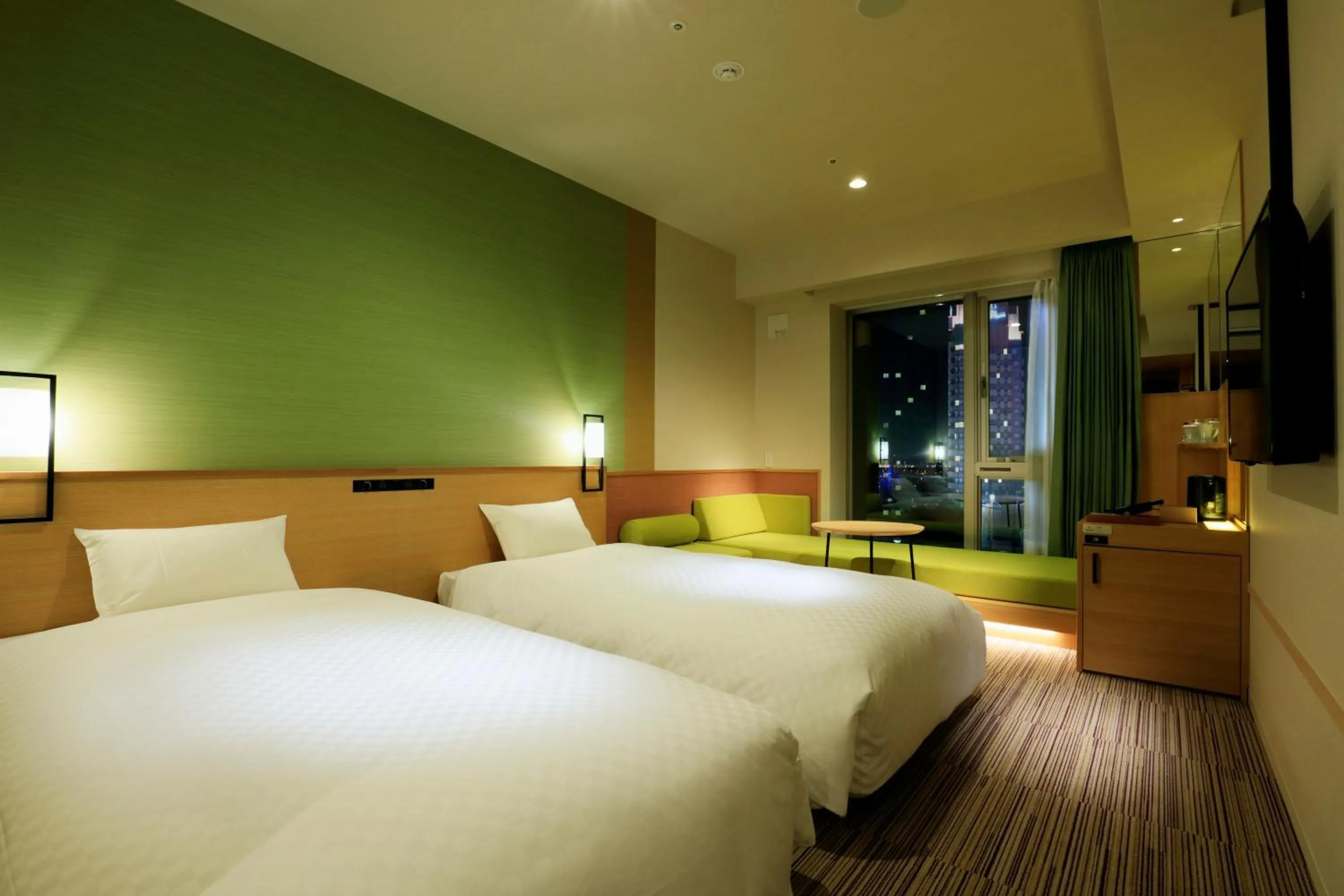 Bed in THE SINGULARI HOTEL & SKYSPA at UNIVERSAL STUDIOS JAPAN