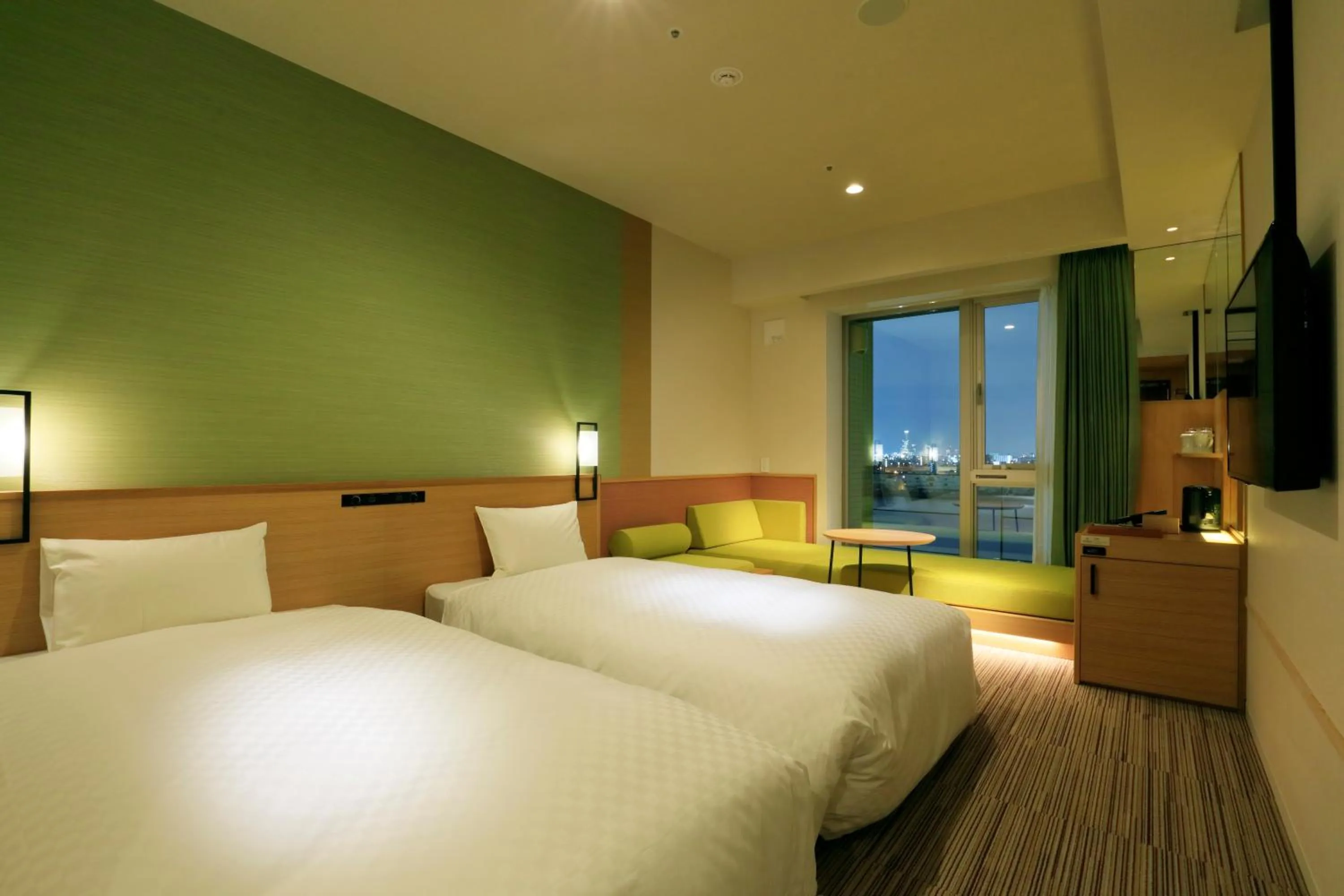 Bed in THE SINGULARI HOTEL & SKYSPA at UNIVERSAL STUDIOS JAPAN