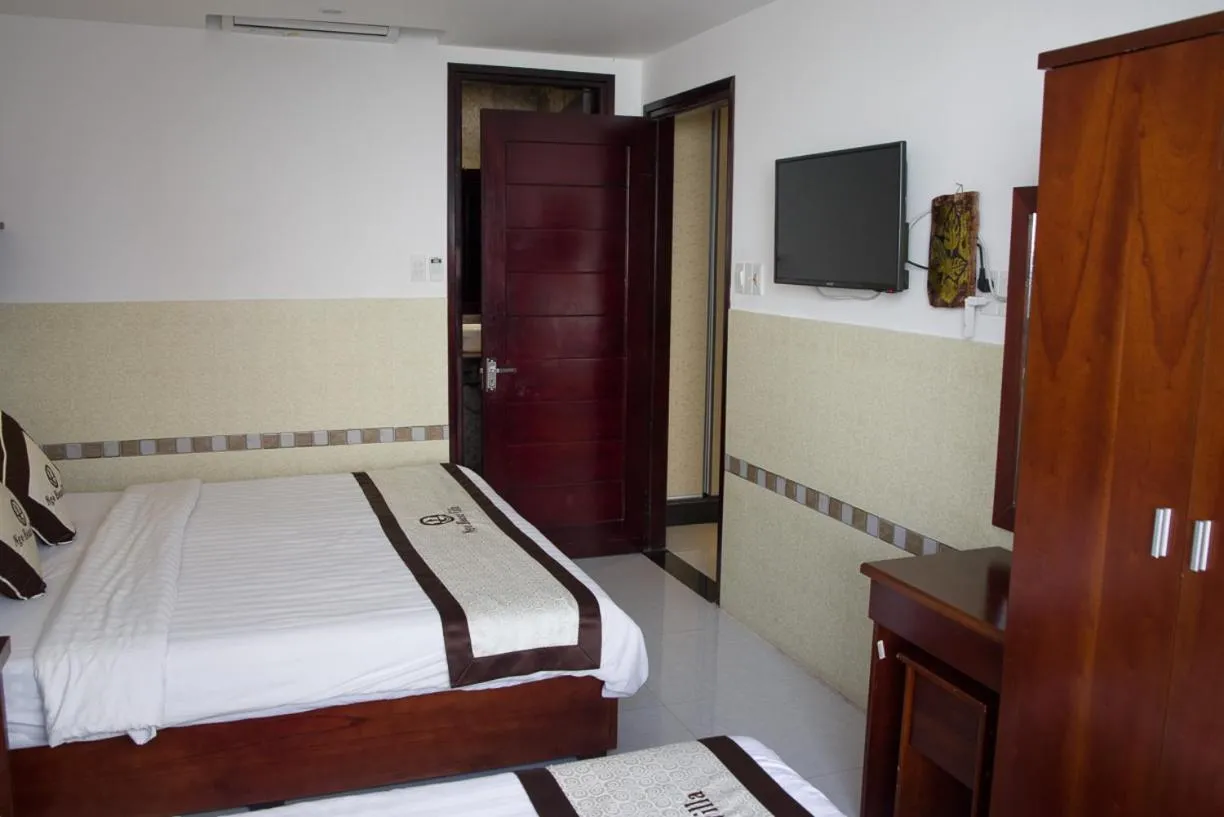 Bed in Ngo House Villa