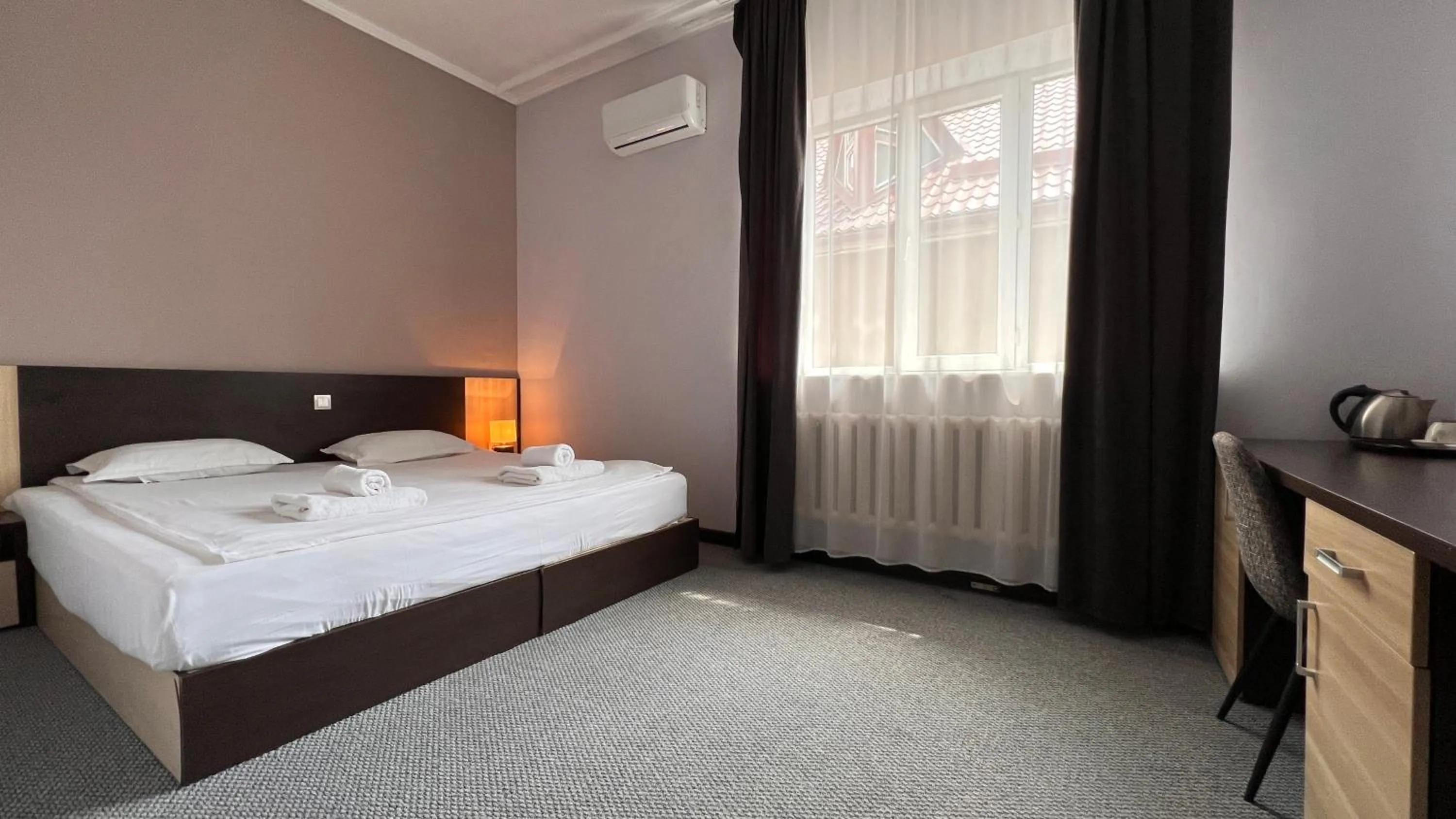 Bed in TourAsia Hotel