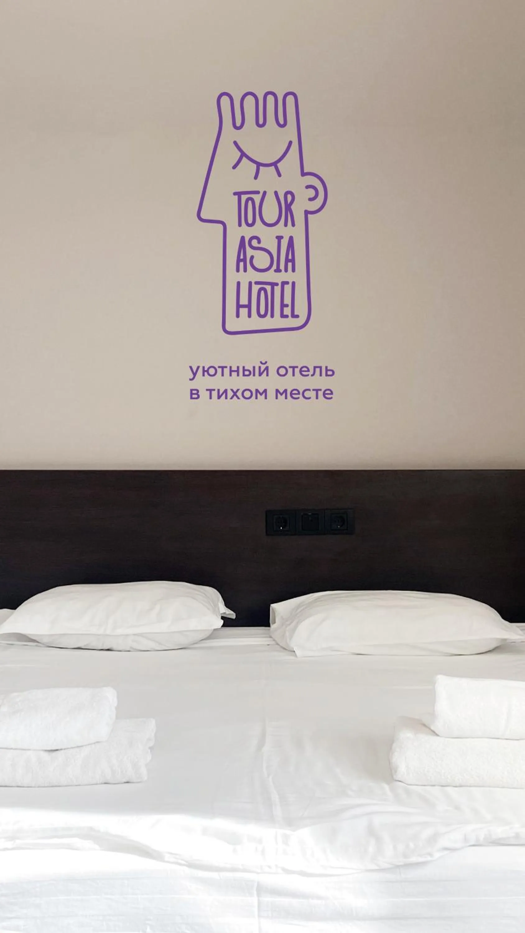 Bed in TourAsia Hotel