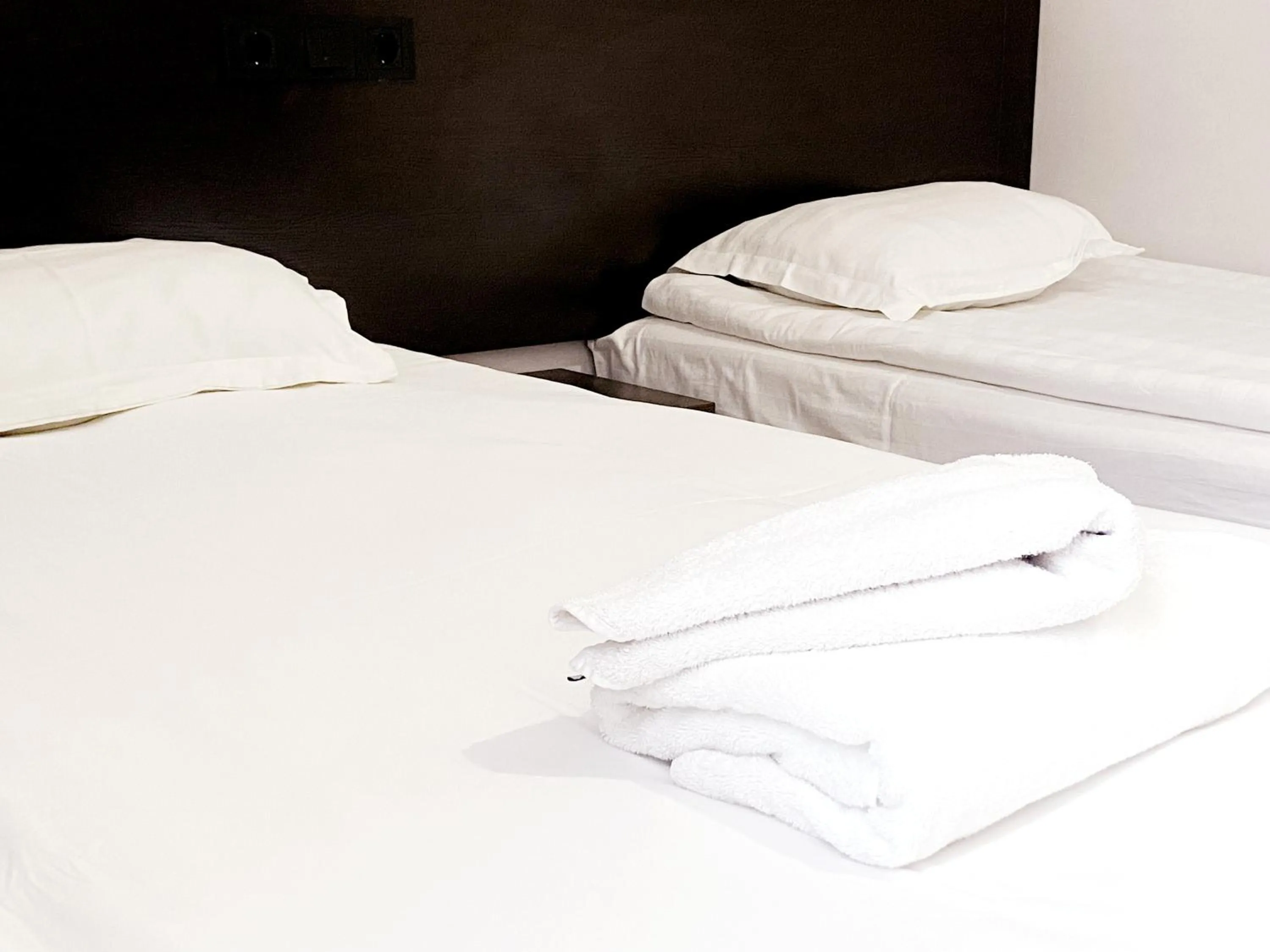 Bed in TourAsia Hotel