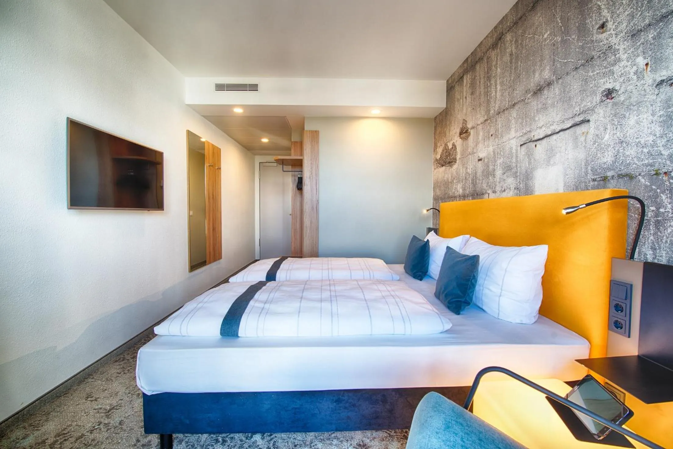 Photo of the whole room, Bed in LOGINN Hotel Leipzig