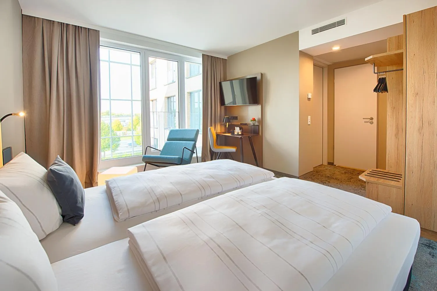 Bed in LOGINN Hotel Leipzig