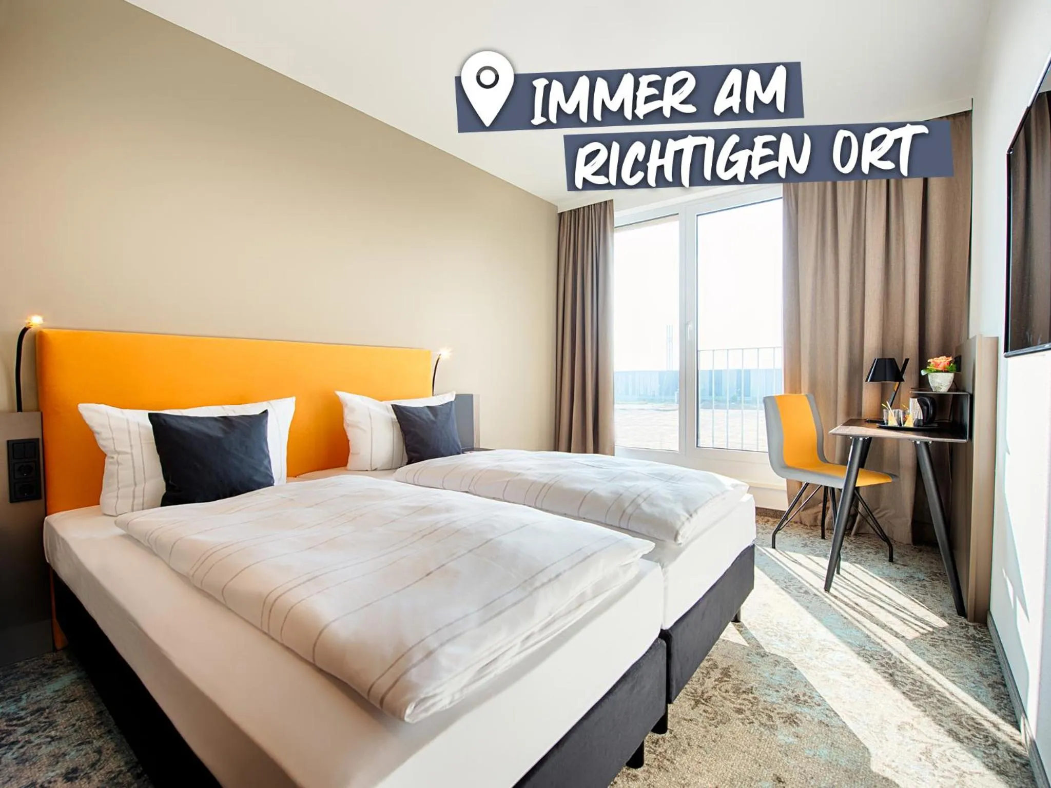 Photo of the whole room, Bed in LOGINN Hotel Leipzig
