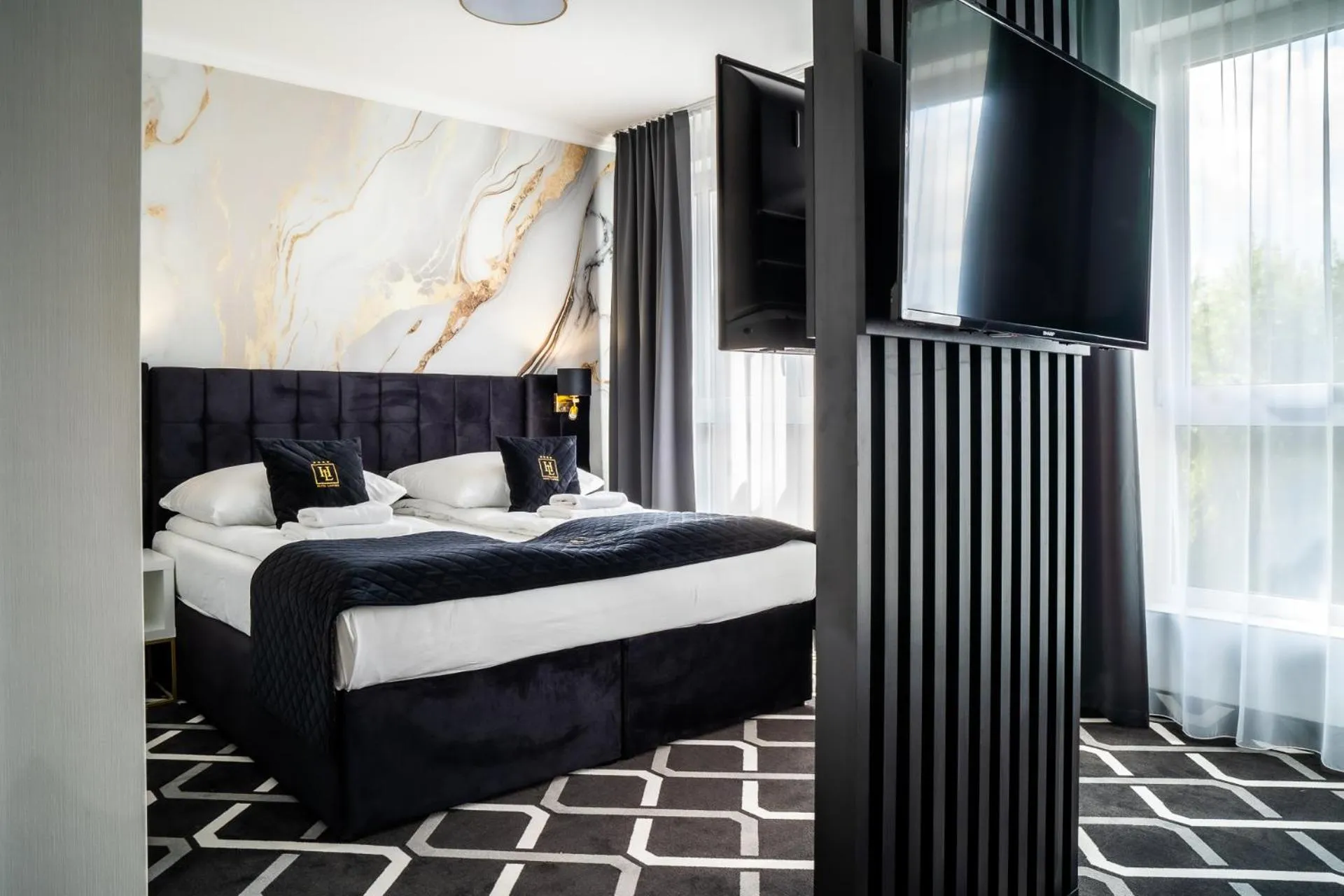 Bed in Hotel Lantier & Swimming Pool Zone