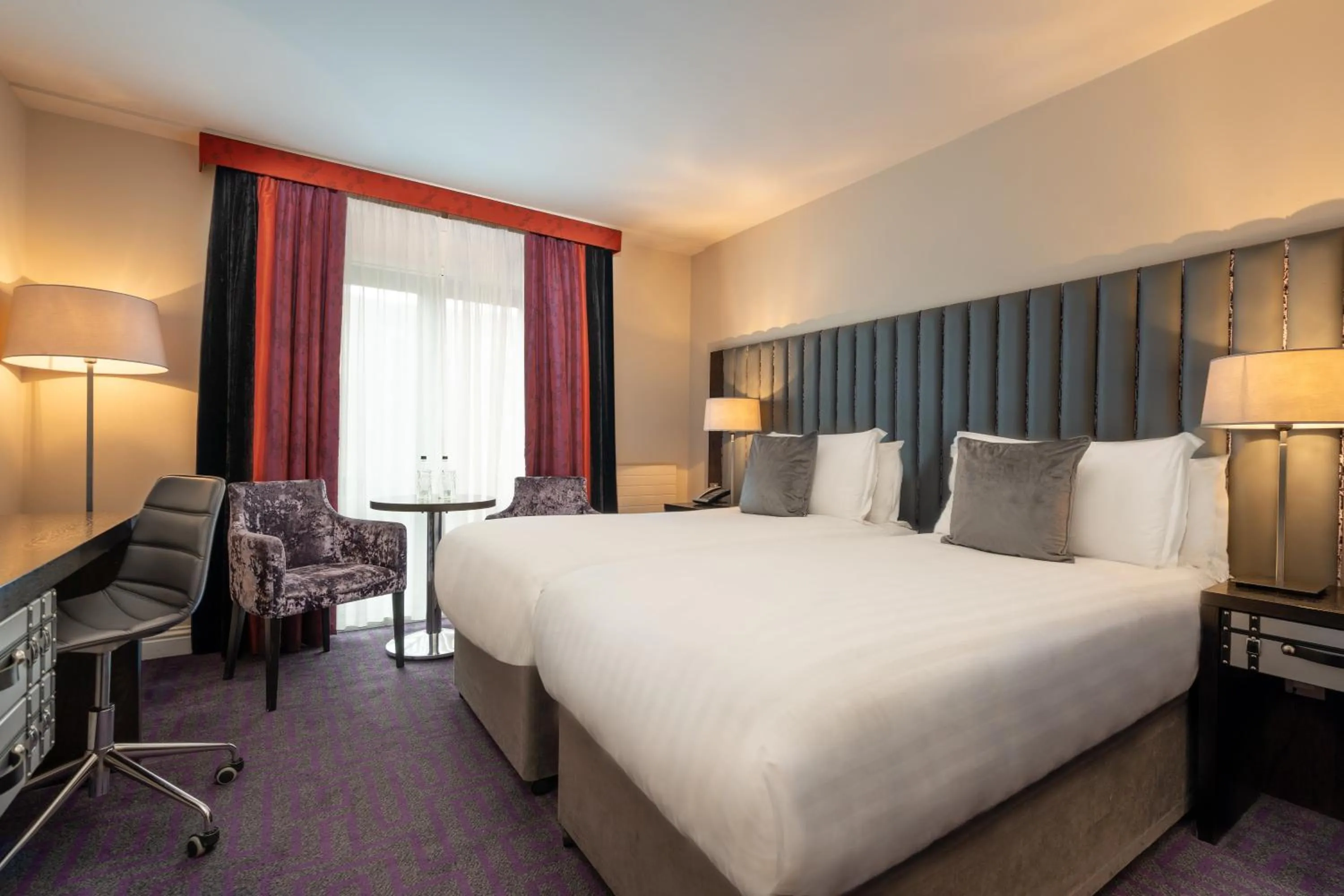 Bed in The Trinity City Hotel