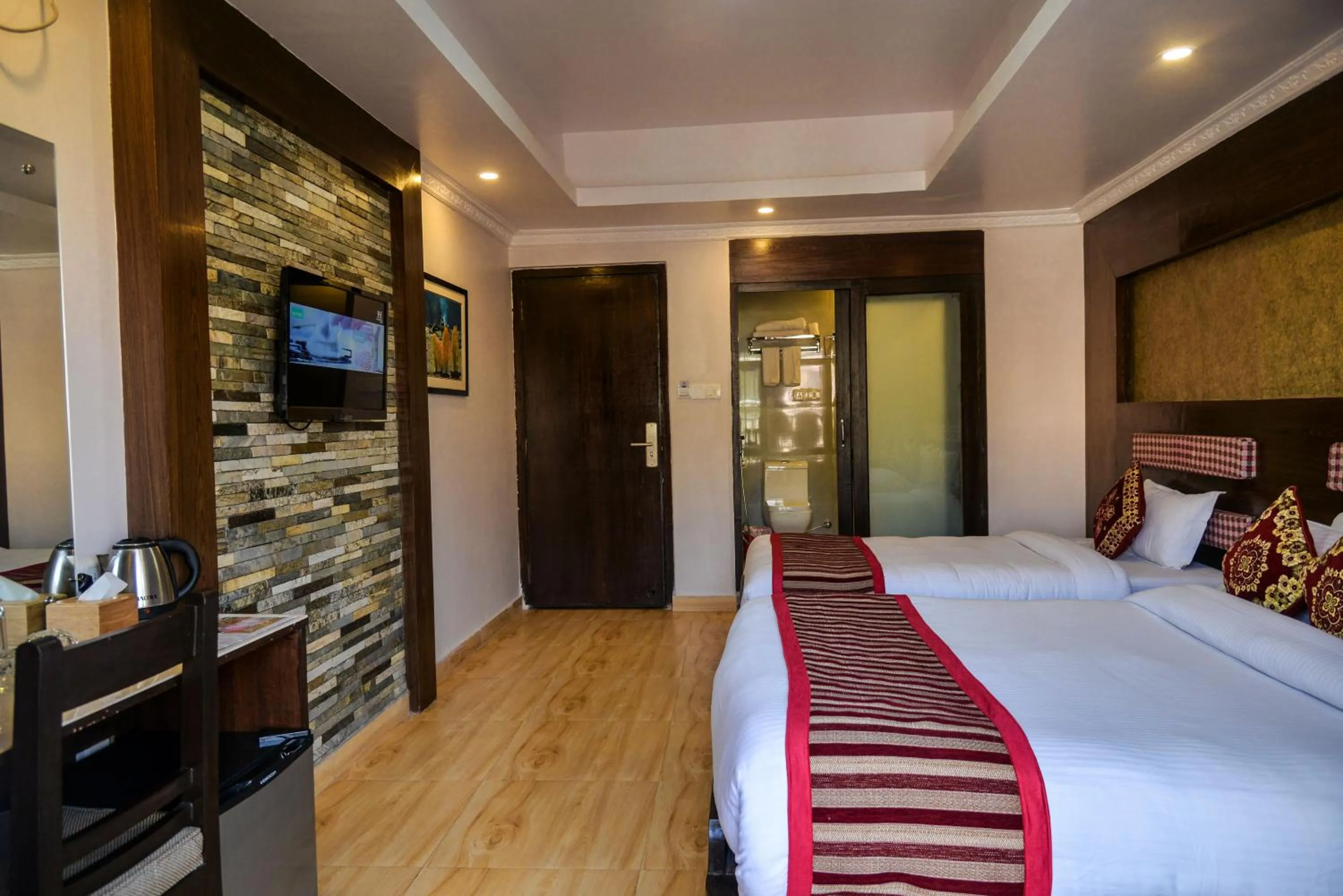 Communal lounge/ TV room, Bed in Kuti Resort & Spa