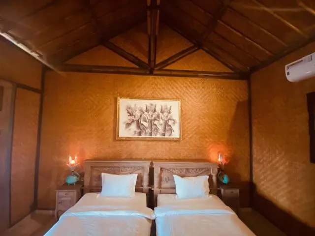 Bed in Sing Sing Resort Lovina