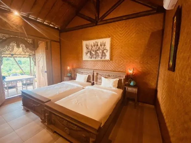 Bed in Sing Sing Resort Lovina