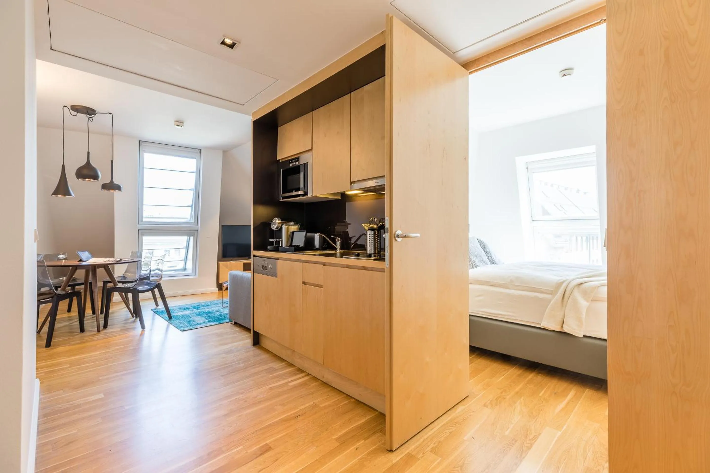 Kitchen or kitchenette, Bed in RAFAEL KAISER - Premium Apartments City Centre - Contactless Check-In