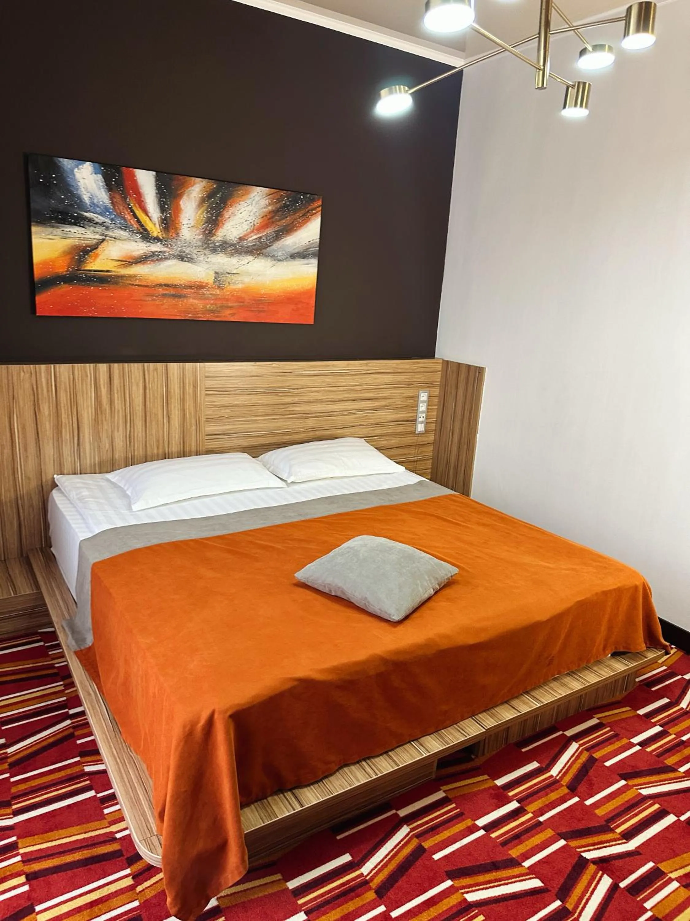 Bed in Mildom Premium Hotel