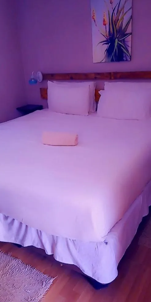 Bed in Chiloto Guest House