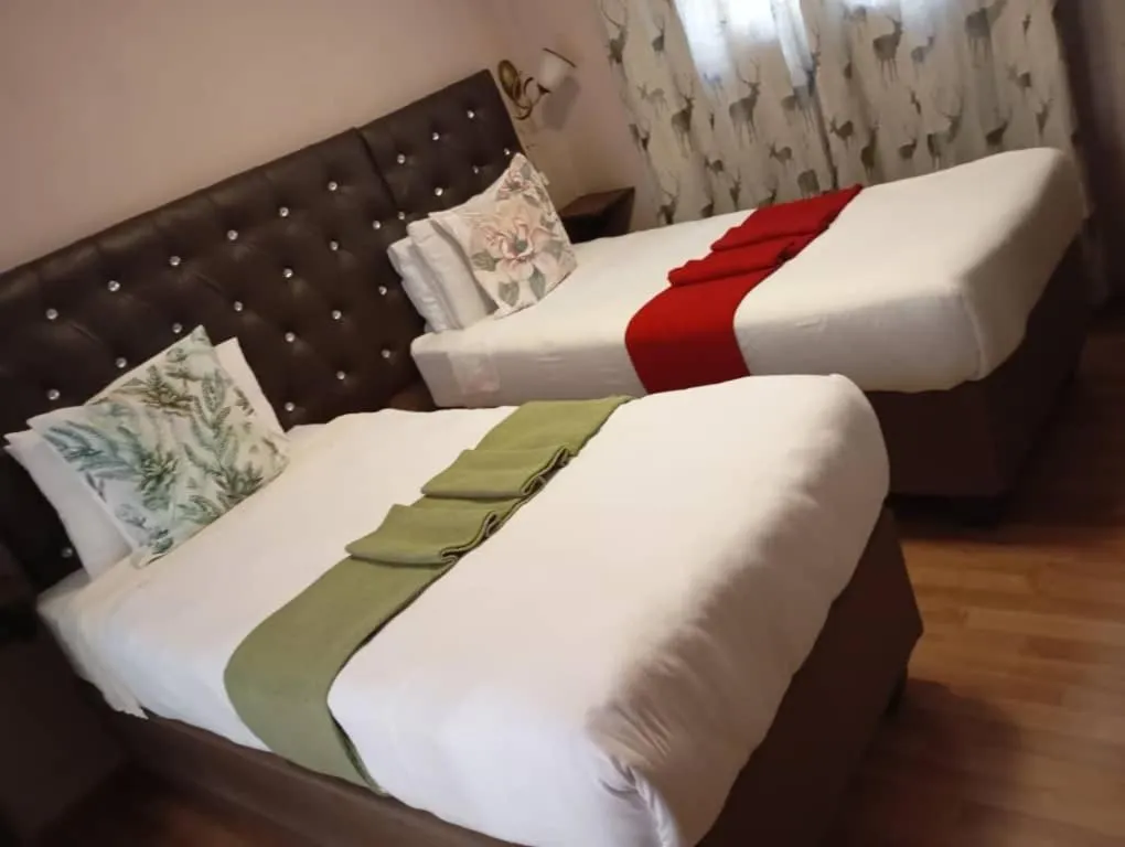 Bed in Chiloto Guest House