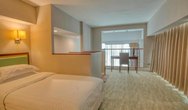 Bed in Yantai Meiya International ApartHotel (Previous Ramada Plaza)