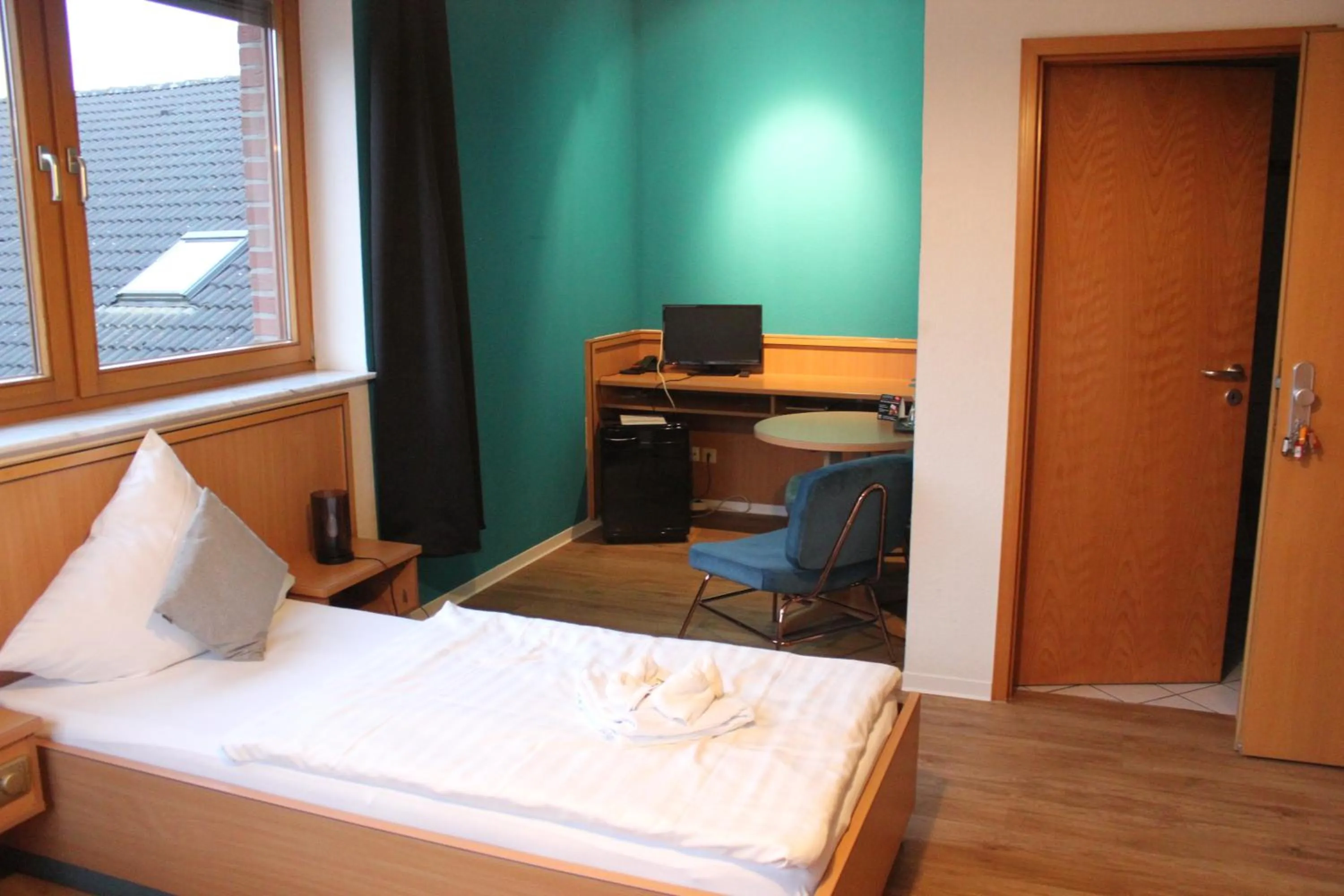 Photo of the whole room, Bed in Olympia Hotel & Restaurant