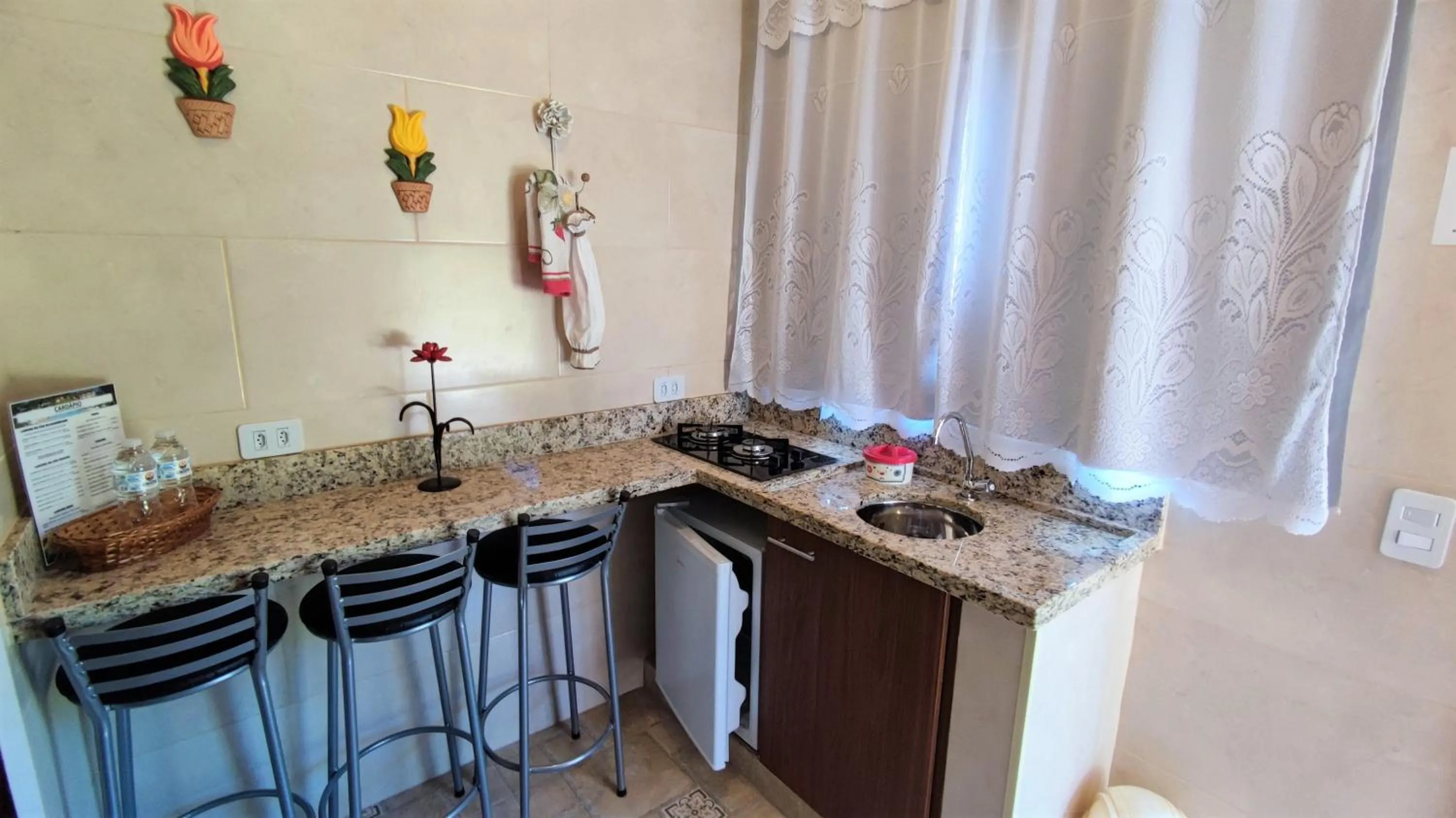 Kitchen or kitchenette in Chalés Vila da Serra