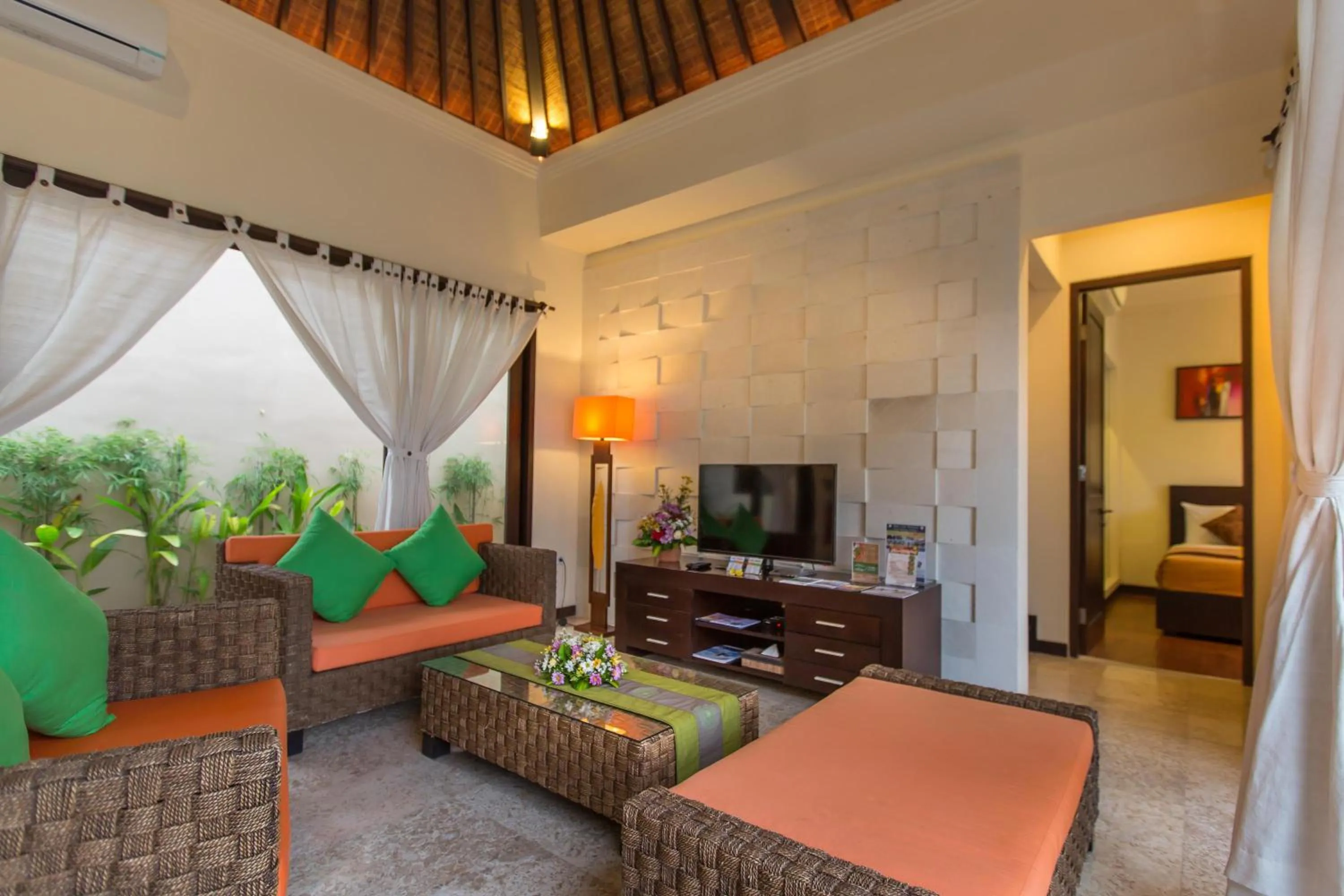 Communal lounge/ TV room in The Reika Villas by Nagisa Bali