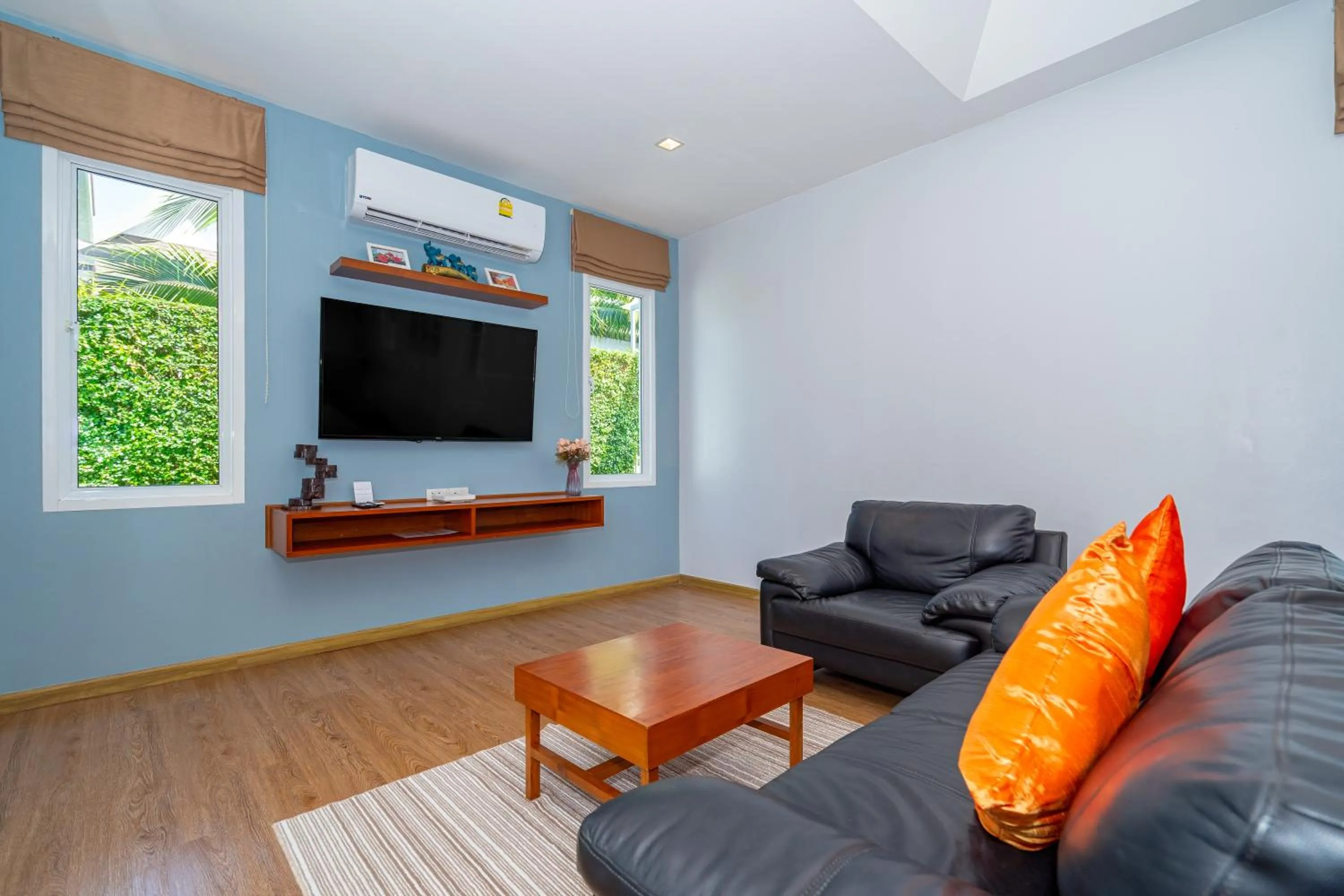 Communal lounge/ TV room in The Orchid Villa