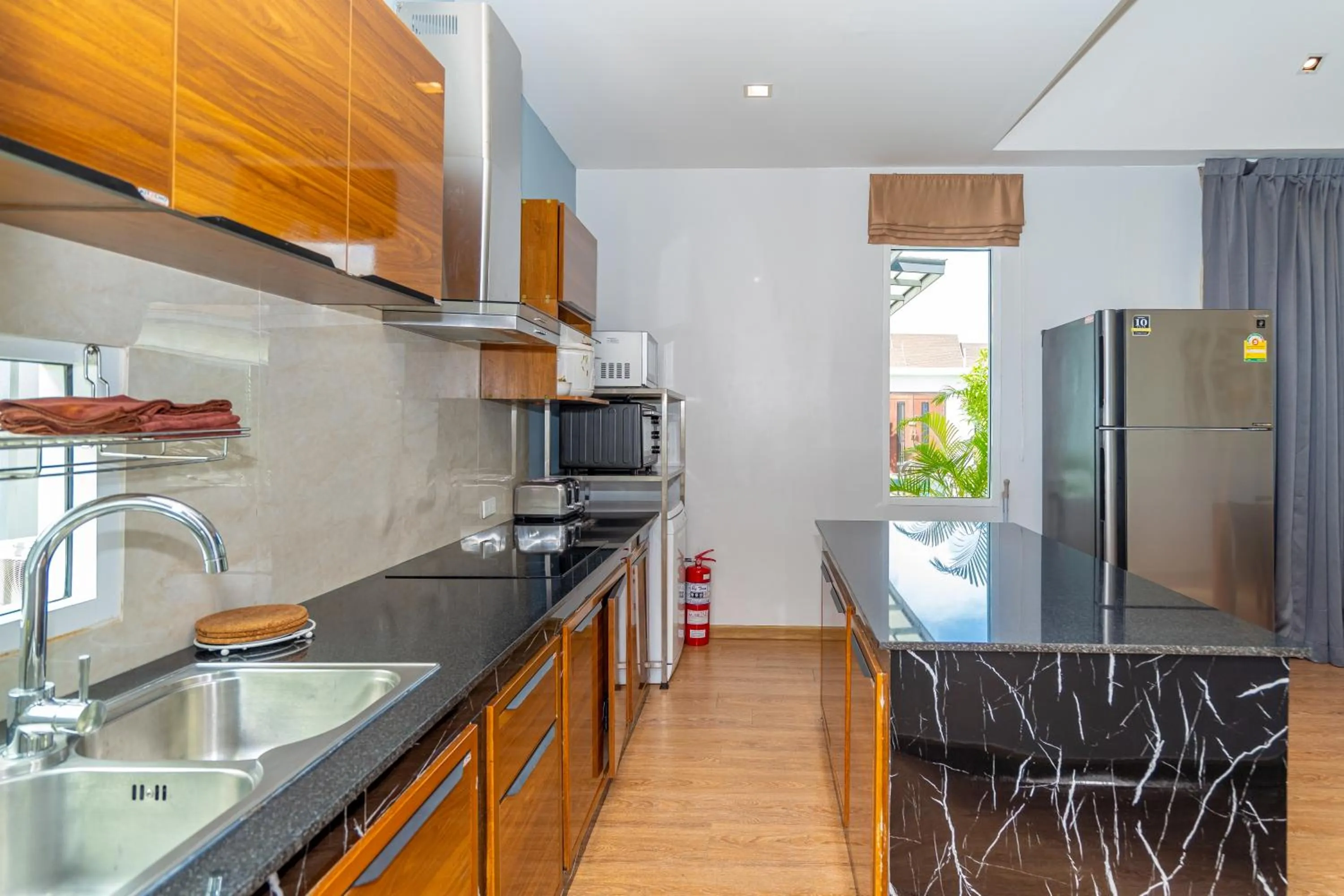 Kitchen or kitchenette in The Orchid Villa