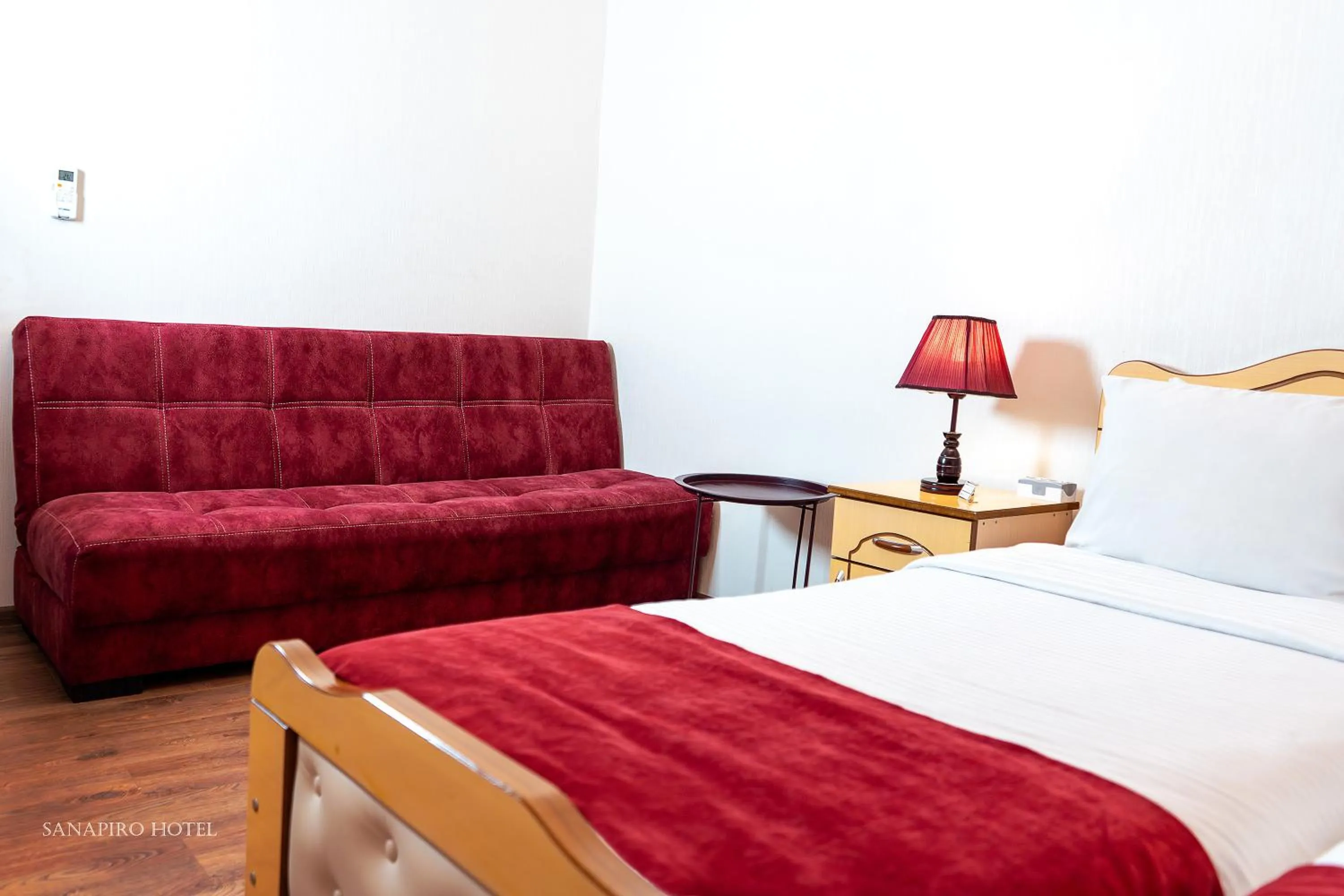 Bed in Sanapiro Hotel