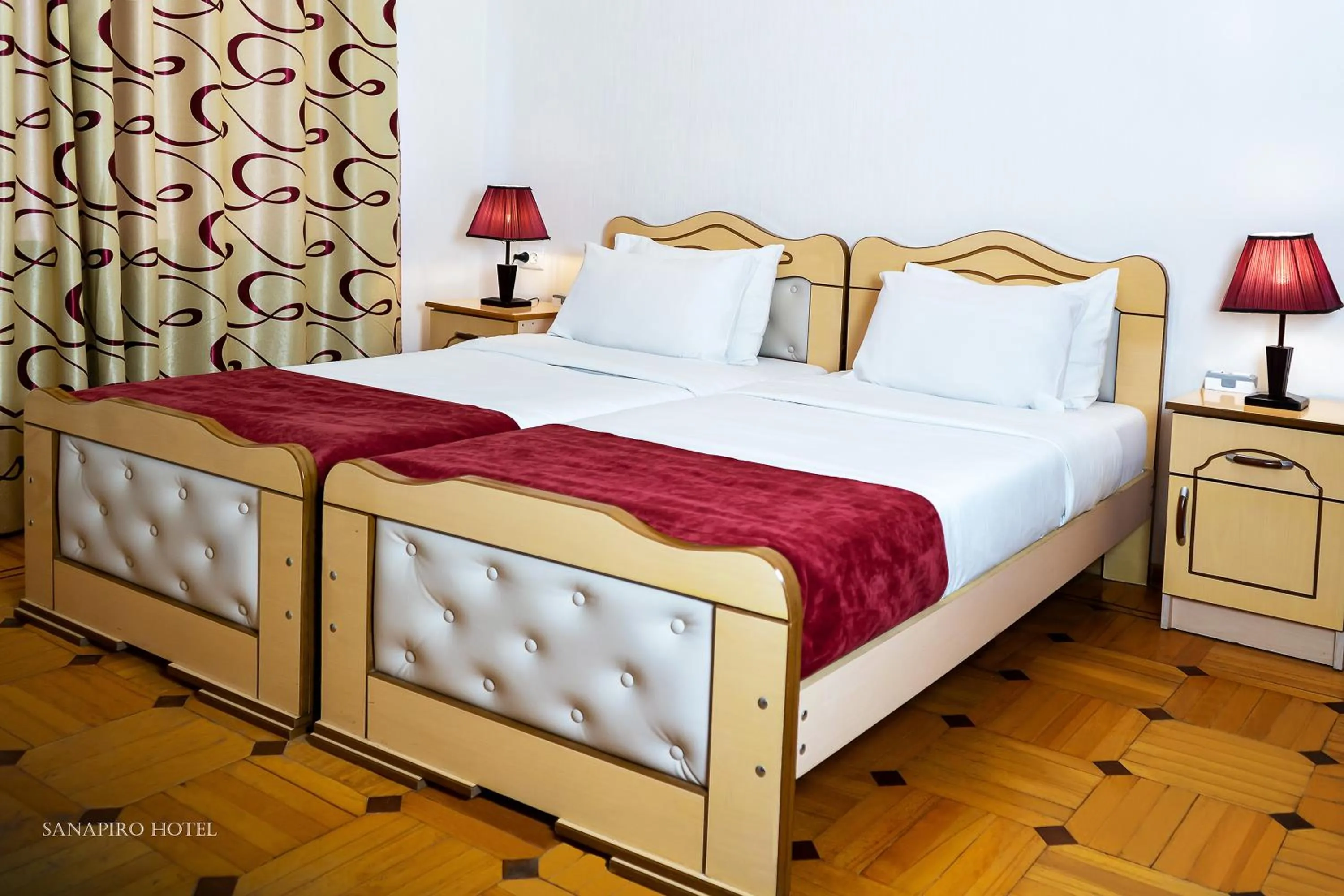 Bed in Sanapiro Hotel